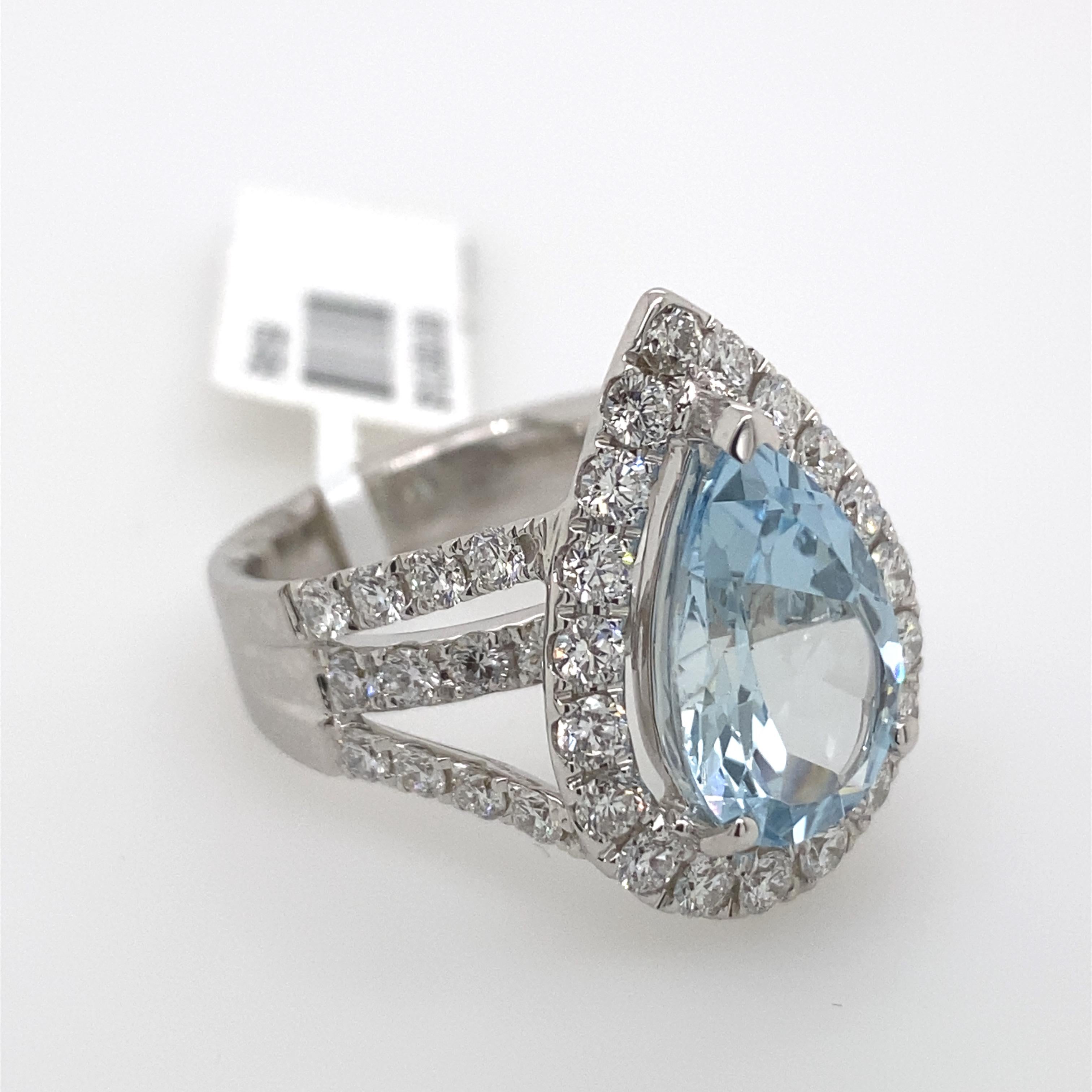Exquisite aquamarine and diamond ring. 
3.63ct pear aquamarine surrounded by 1.74ct of round brilliant diamonds. 5.37ct total gemstone weight, set in 18-karat white gold.
Accommodated with an up to date appraisal by a GIA G.G., please contact us