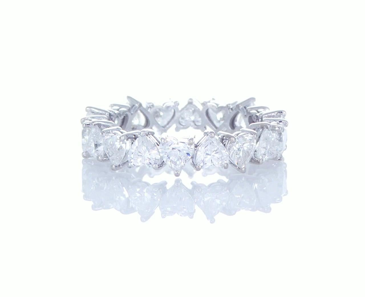 Our Dazzling Eternity Ring is handcrafted from 18 heart shaped cut diamonds that are ideal cut and were manufactured to match each other. Matching diamond hearts require perfection and knowledge which translates to an eye catching lushness. The high