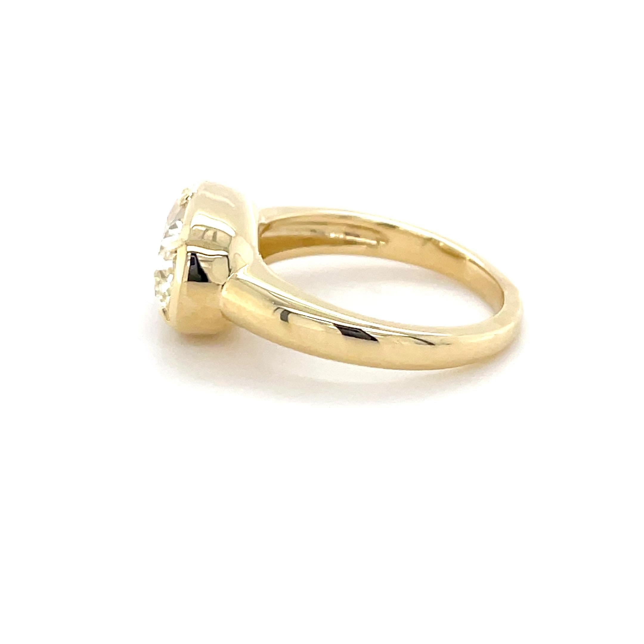 This unique ring, boasts an approximate 3.65 carat elongated cushion cut diamond mounted in collet style claw prongs, in a beautiful flush setting. Perfect for the heirloom seeker! 

Metal: 18 Karat Gold
Ring Size: 6 1/2
Stamp: 18K
Total weight: