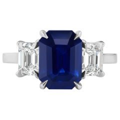 3.65 Carat Emerald Cut Blue Sapphire and Diamond Three-Stone Ring