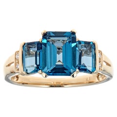 Bague en or jaune 10 carats avec diamants et topaze bleue taille émeraude de Londres de 3,65 carats