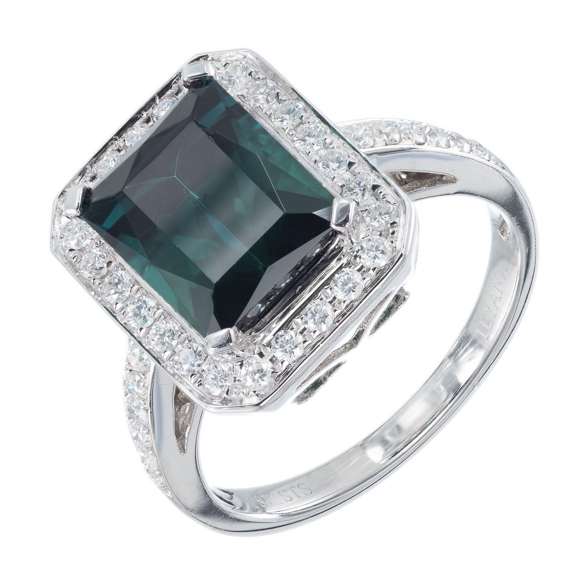 Tourmaline and diamond halo engagement ring. 3.65 carat emerald cut center stone with 36 full cut accent diamonds in a 18k white gold setting. 

1 fine bright green Emerald cut Tourmaline, approx. total weight 3.65cts, 10 x 8.1mm
36 full cut