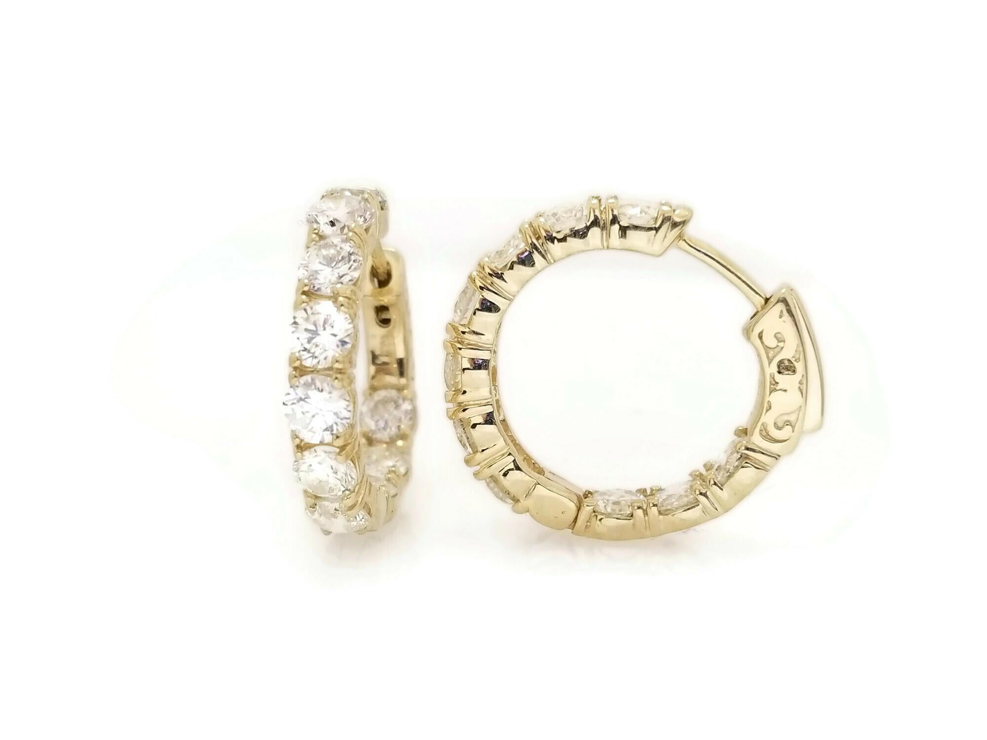Beautiful pair of huggie diamond inside out hoop earrings available in 14k yellow gold. Secures with snap closure for wear.  Measures 0.75 inch Diameter. Color H, Clarity VS, Shiny, Eye Clean. Beautiful look on any day ! 