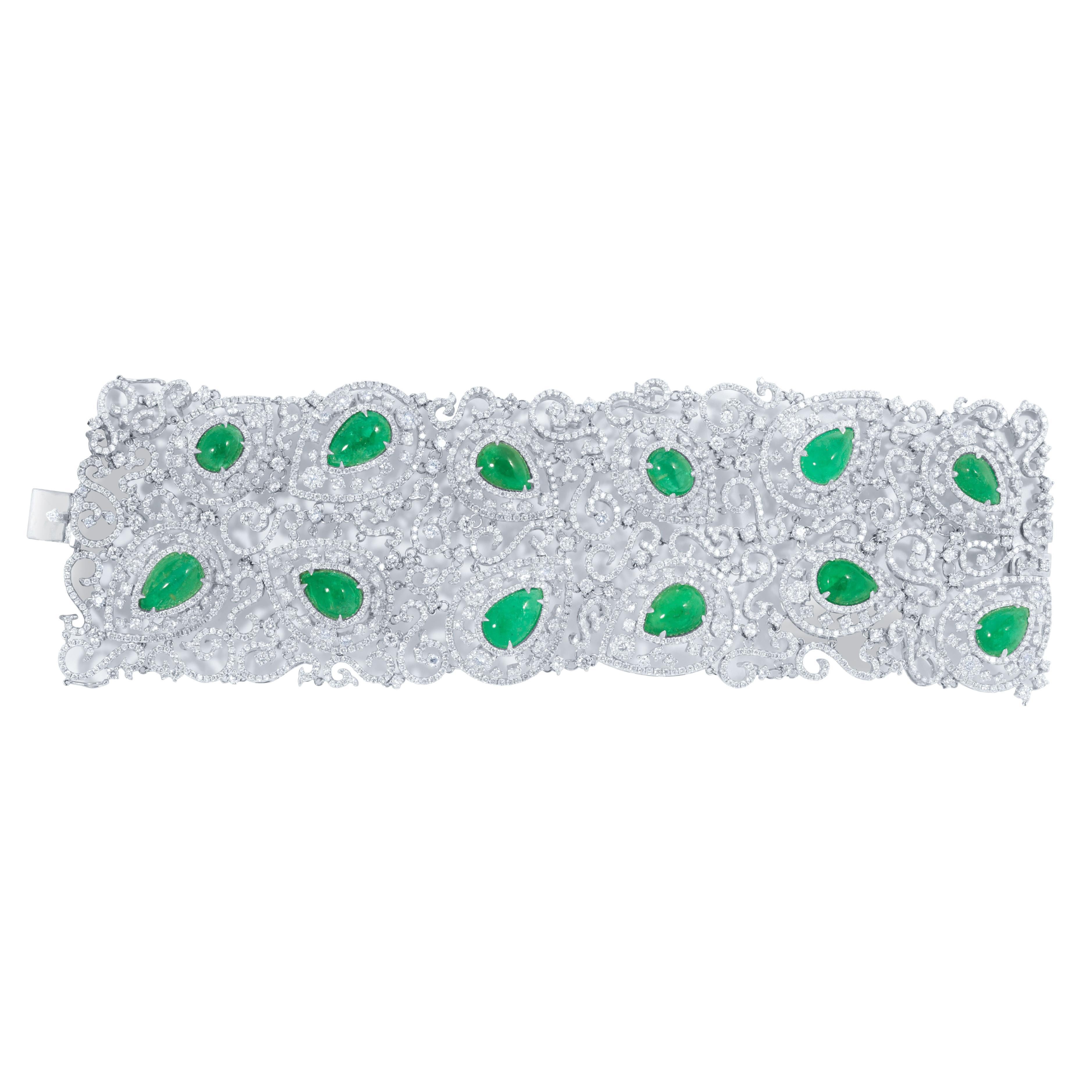 Open work 18 kt white gold diamond soft fashion bracelet adorned with 36.50 cts tw of diamonds and with 48.73 cts tw of green emeralds laid throughout (C.Dunaigre Certified)