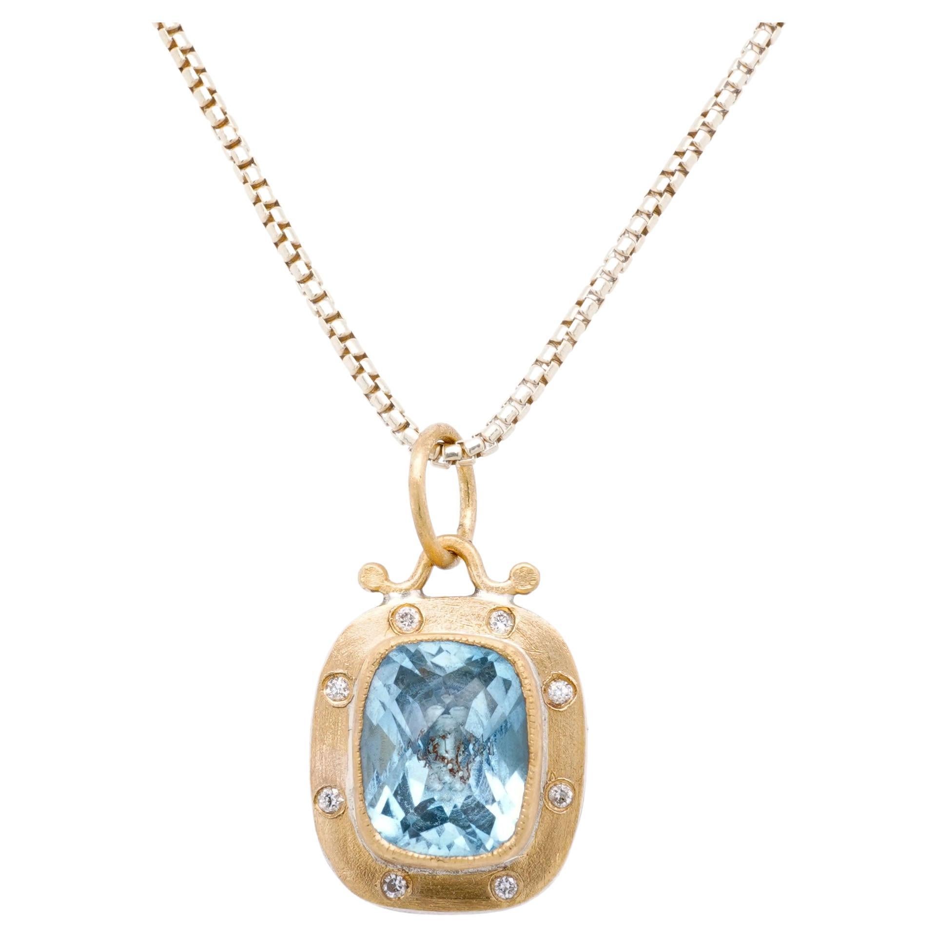 3.65ct Faceted Checkerboard Light Blue Topaz Charm Pendant Necklace with Diamonds, 24kt Gold and Silver by Prehistoric Works of Istanbul, Turkey. Light Blue Topaz - 3.65cts, Diamonds - 0.08cts. This stunning topaz is framed in 24kt gold with 8