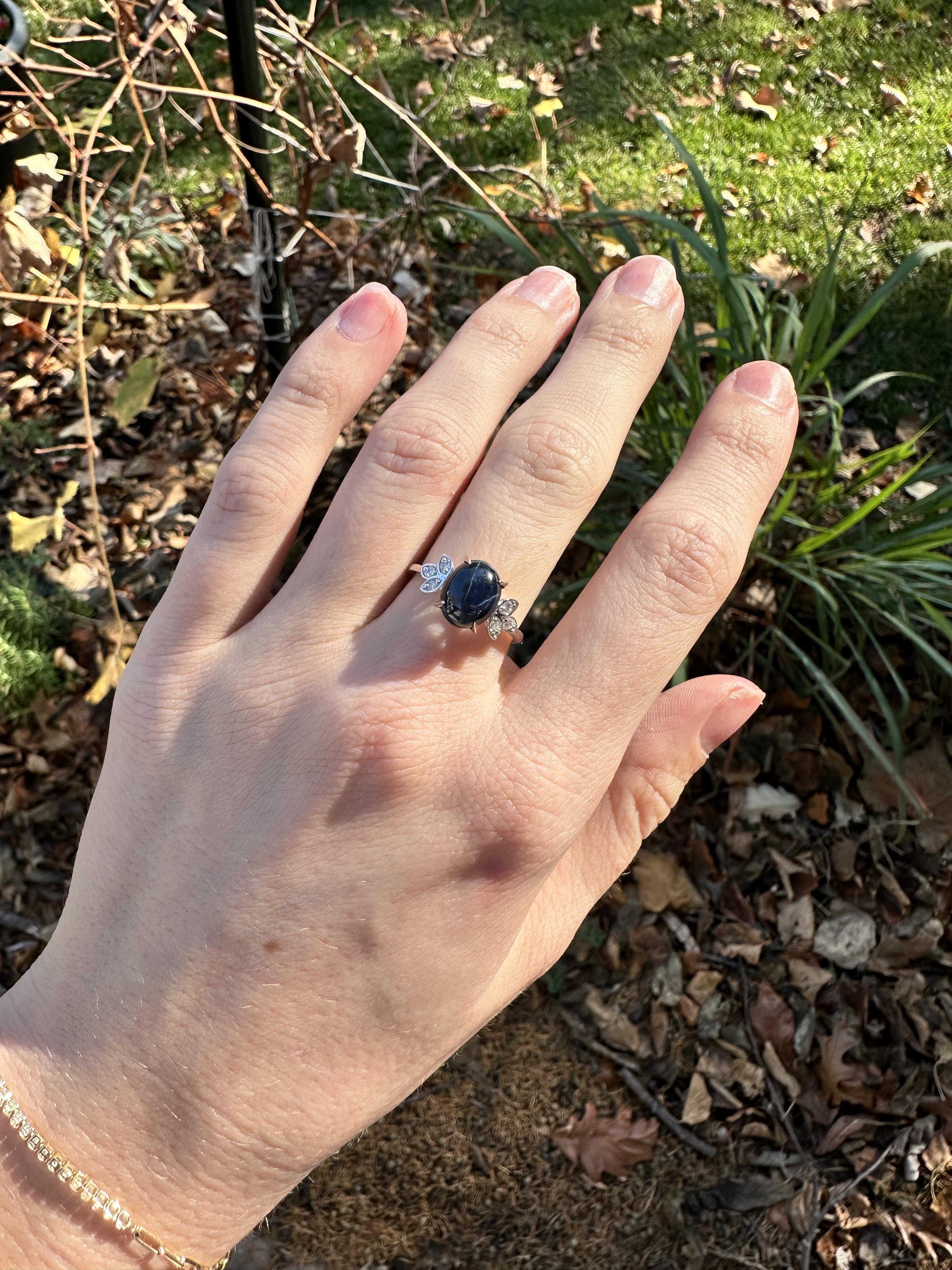 This mesmerizing 3.65ct Star Sapphire Ring features a stunning Diamond Accents, set in Solid 14K White Gold. Make a statement with this timeless piece of jewelry.

This Star Sapphire ring makes a lovely September birthstone gift for your loved