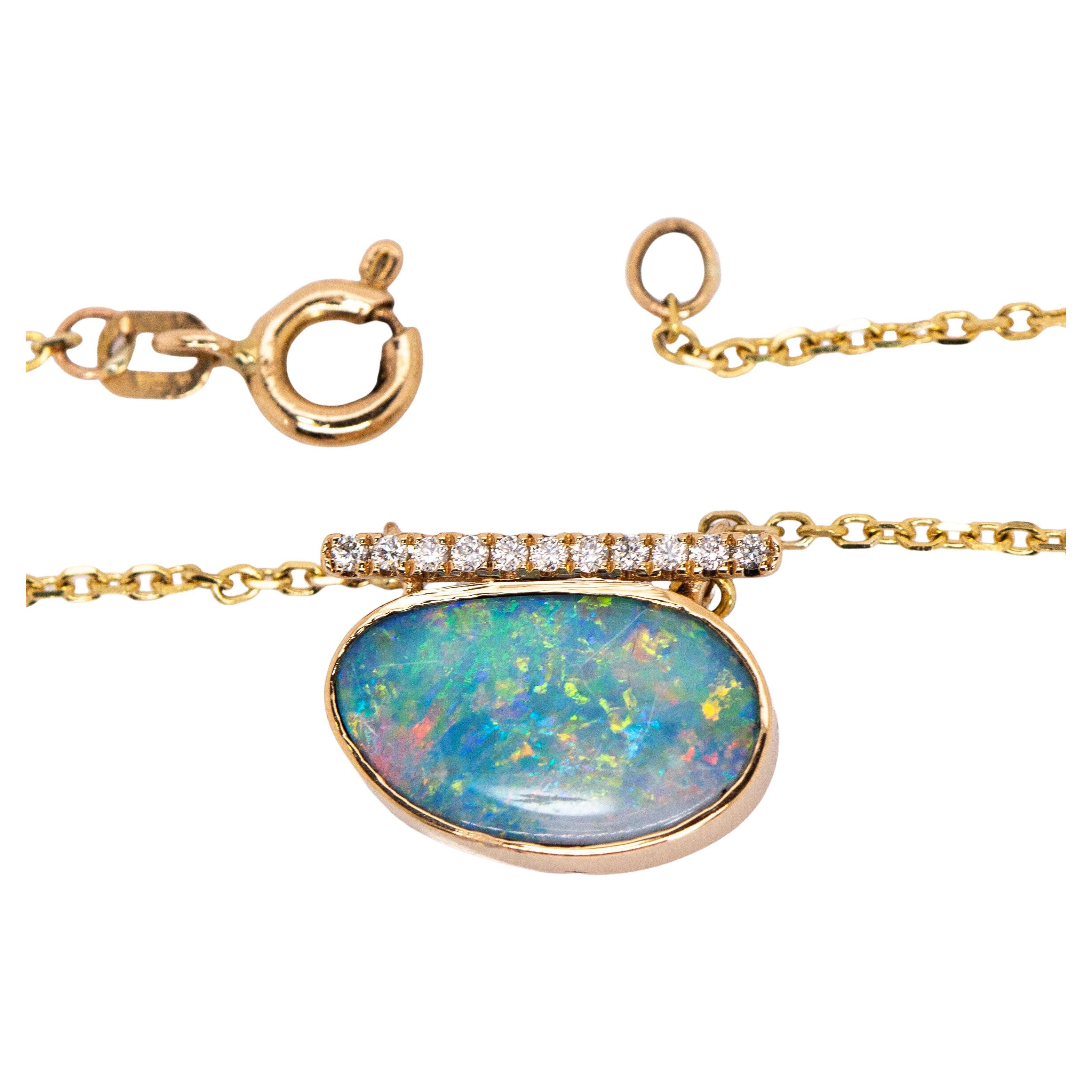 3.65cts, 15x10mm Boulder Opal Pendant w Natural Diamond Accents in 14K Gold