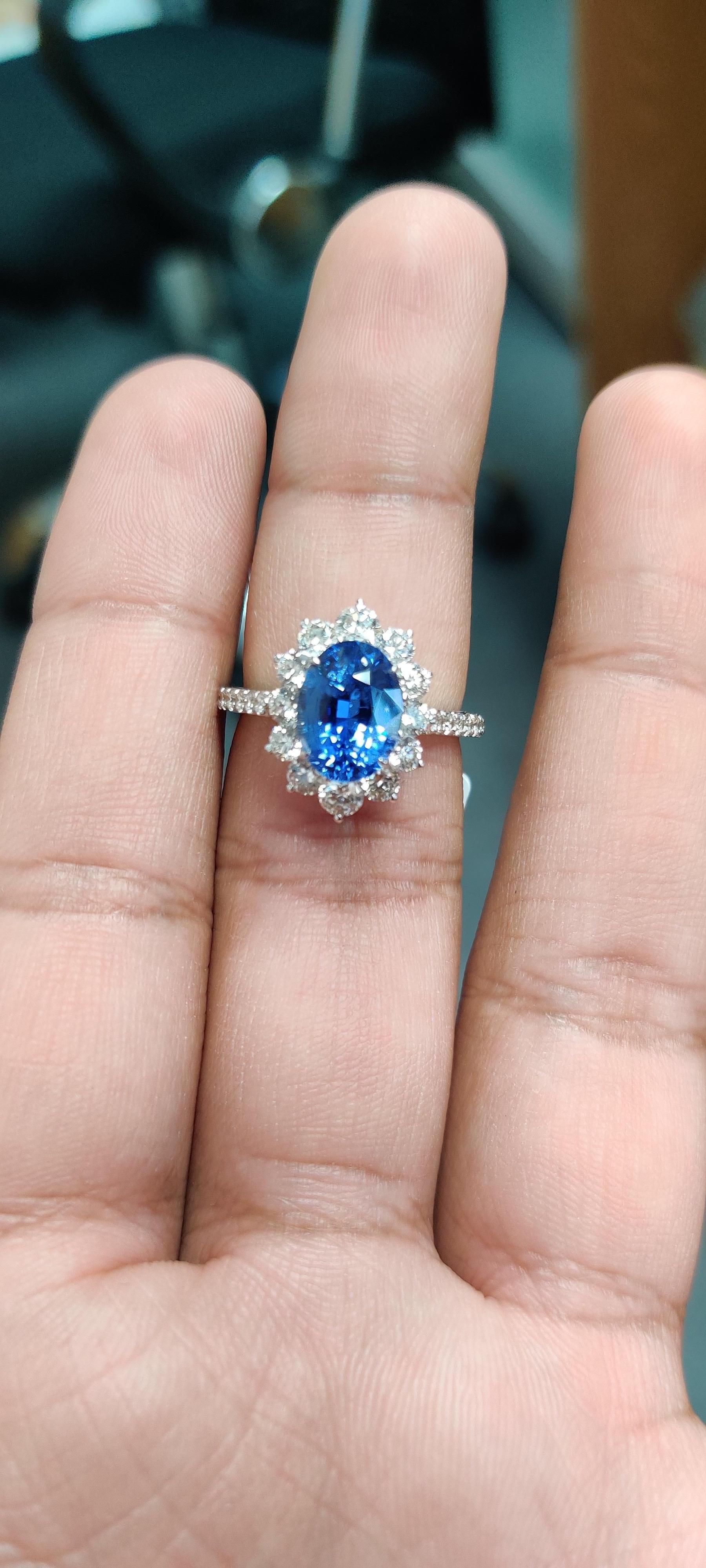 Introducing our captivating 18K Gold Oval Sapphire Ring, a timeless masterpiece of elegance and luxury. This exquisite ring features a breathtaking 3.66 carat oval sapphire, sourced from Sri Lanka, renowned for its deep royal blue color and