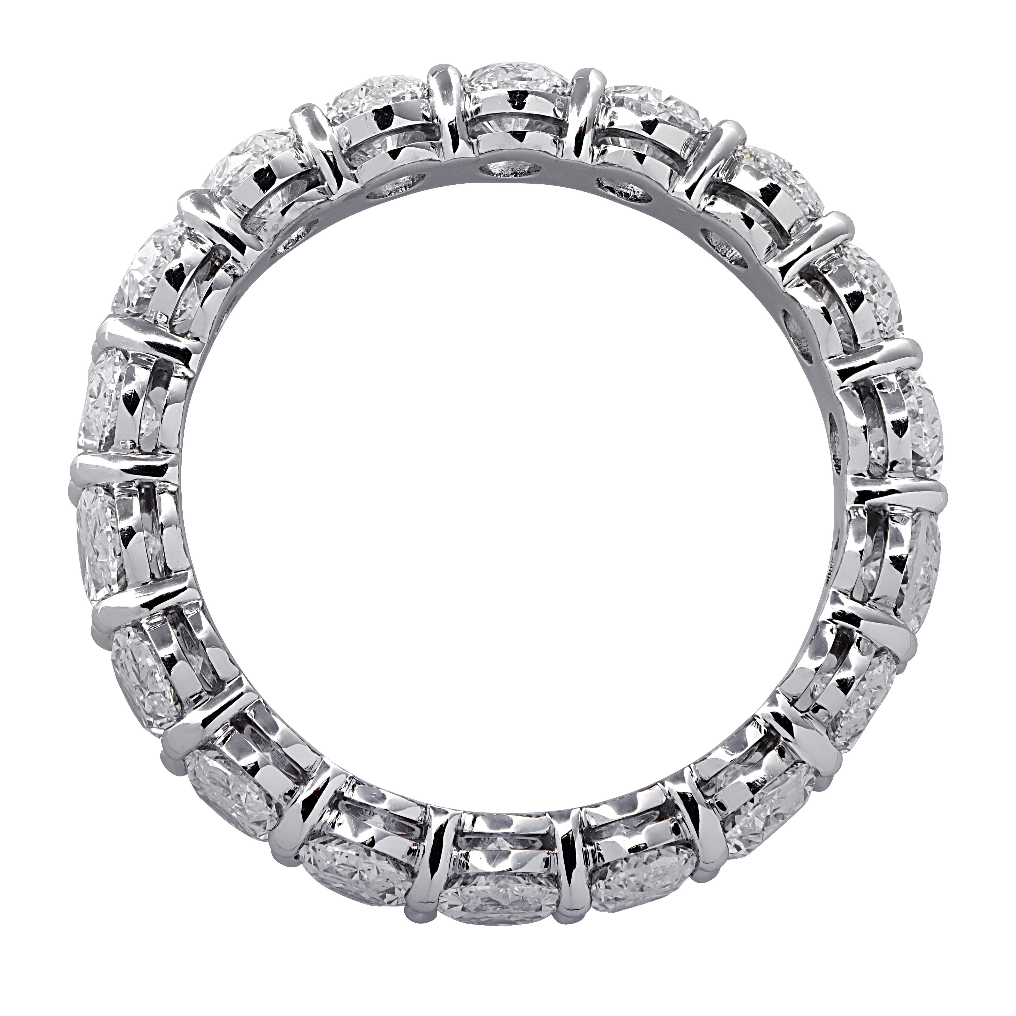 Exquisite Vivid Diamonds eternity band crafted in Platinum, showcasing 18 stunning oval cut diamonds weighing 3.66 carats total, F-G color, VVS-VS clarity. Each diamond is carefully selected, perfectly matched and set in a seamless sea of eternity,