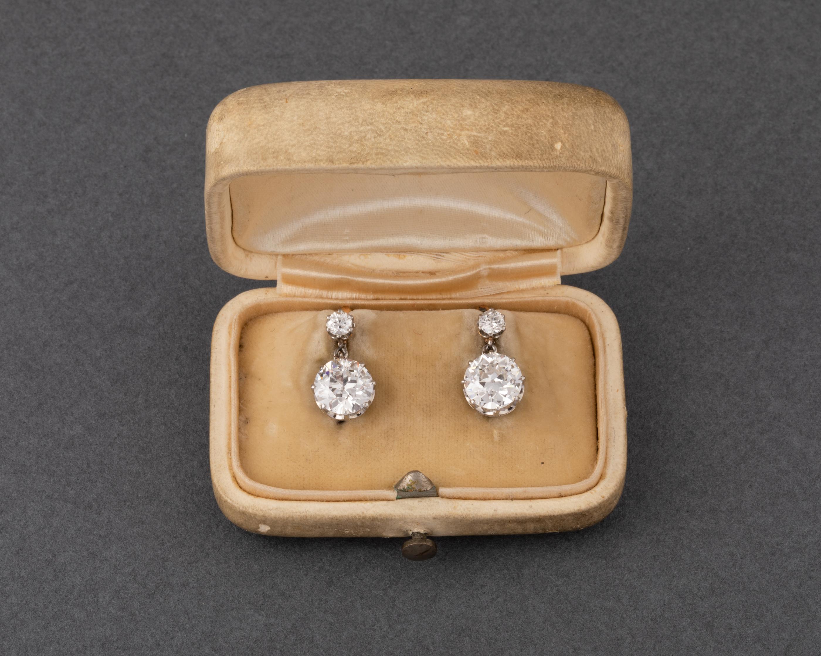 One very beautiful pair of antique Belle Epoque earrings, made in France circa 1900.
In a boxe of the great jewelry family Sandoz.
The two principal diamonds weights 1.80 and 1.76 exactly. 
They are extra white color: E/F color for my estimation,