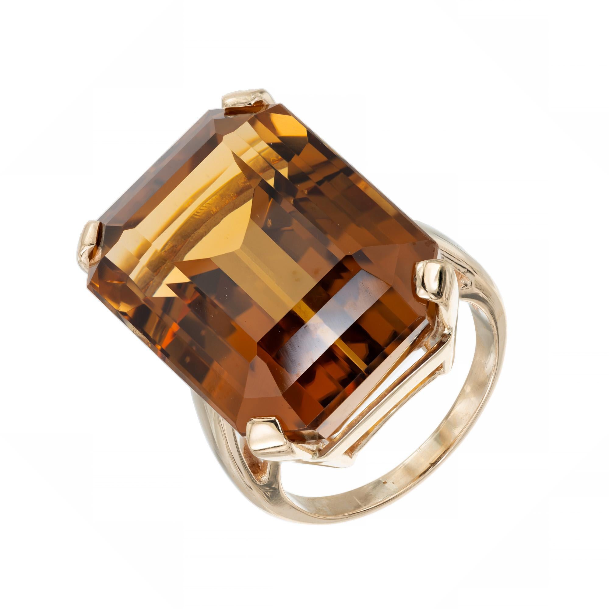 Vintage 1960's burnt orange ( Madera ) color emerald cut citrine ring cocktail ring. Stunning 36.60 Carat Madera Emerald Cut Citrine set in a 14k yellow gold setting. The citrine color is vibrant and rich with yellow and orange hues. 
The Madera