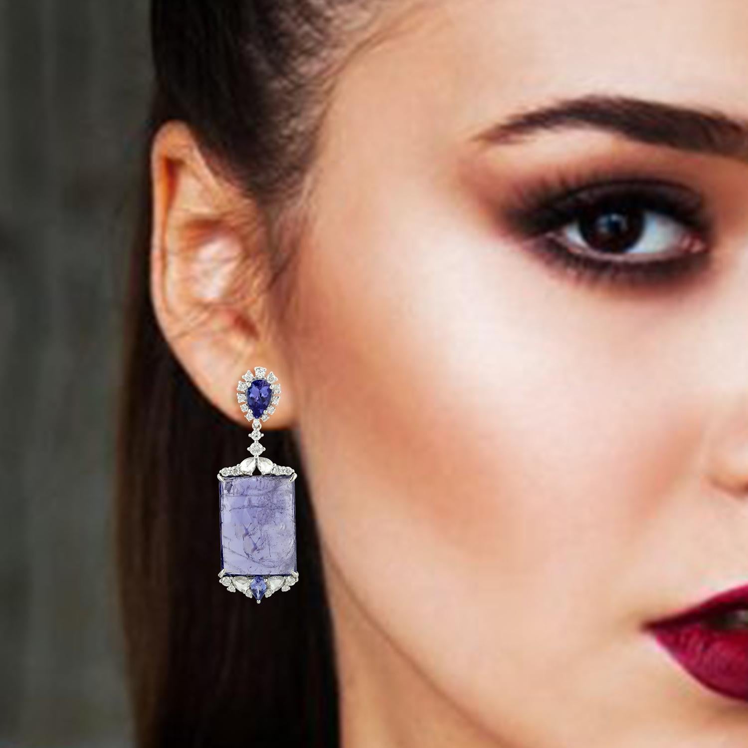 These beautiful drop earring are handcrafted in 18-karat gold. It is set with 36.63 carats tanzanite and 2.0 carats of sparkling diamonds.

FOLLOW  MEGHNA JEWELS storefront to view the latest collection & exclusive pieces.  Meghna Jewels is proudly