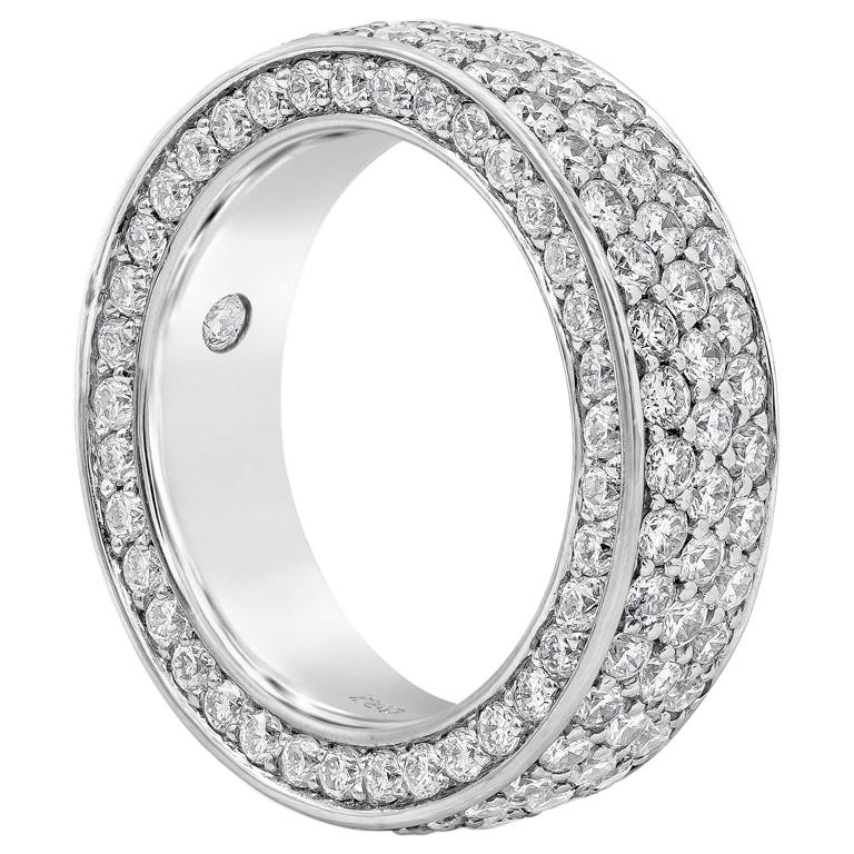 A brilliant ring style showcasing 185 round brilliant diamonds, Diamonds weigh 3.67 carats total. A single round diamond is flush set inside the cigar band. Made with 18K White Gold. Size 6 US. 

Style available in different price ranges. Prices are