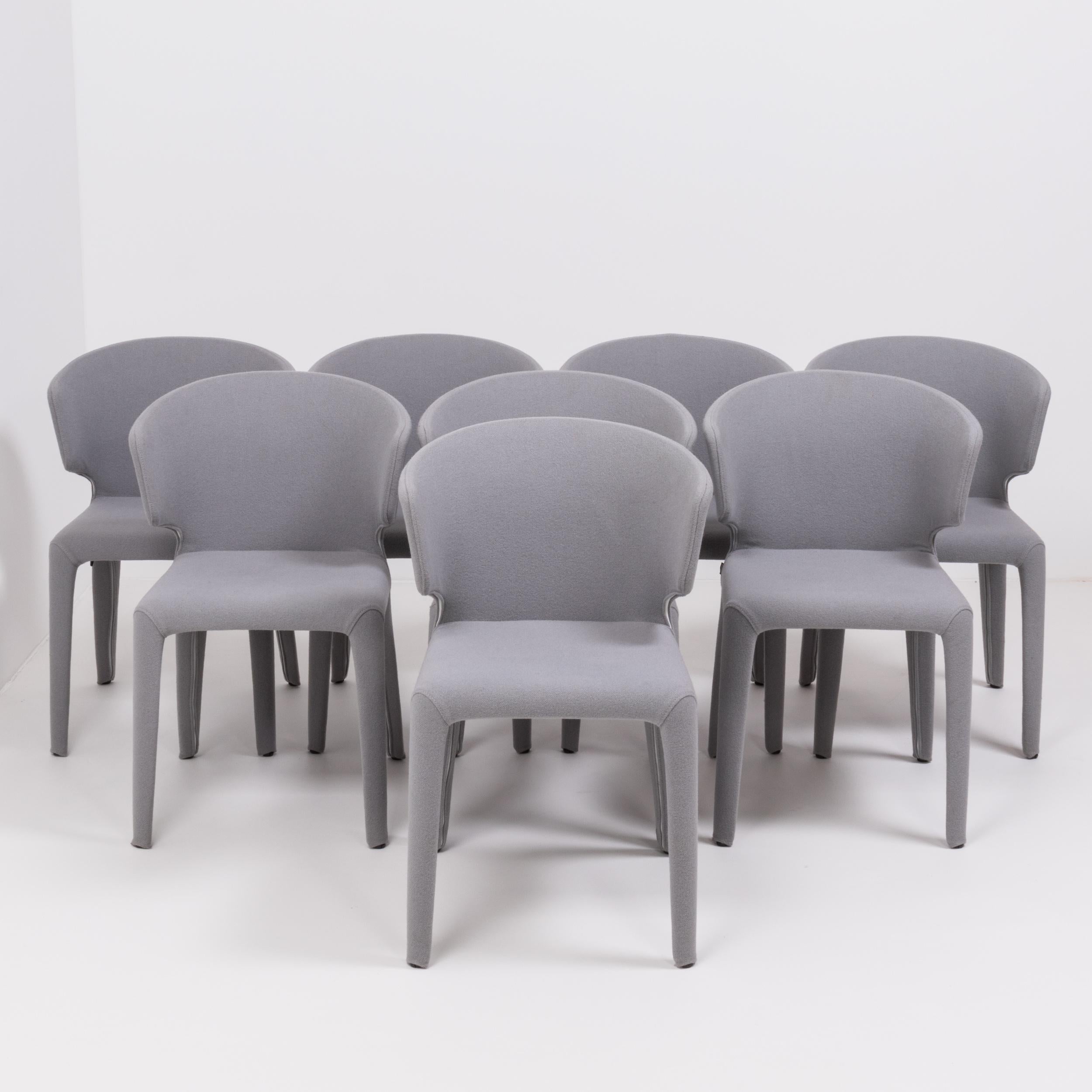 Designed by Hannes Wettstein for Cassina in 2003, these 367 Hola chairs have a sleek, contemporary silhouette.
 
The set of eight chairs are in excellent, nearly new condition and are fully upholstered in grey wool with zips that allow the covers