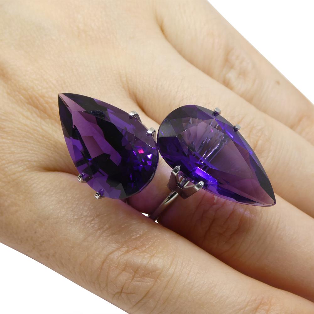 Description:

Gem Type: Amethyst
Number of Stones: 2
Weight: 36.72 cts (17.92ct / 18.80 ct)
Measurements: 25.19 x 19.43 x 9.75 mm / 24.97 x 19.65 x 10.93 mm
Shape: Pear
Cutting Style:
Cutting Style Crown: Brilliant Cut
Cutting Style Pavilion: