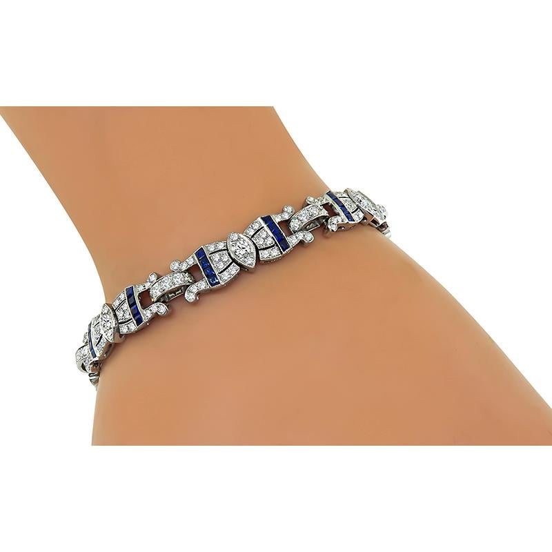 This is an elegant 18k white gold bracelet. The bracelet is set with sparkling round cut diamonds that weigh approximately 3.67ct. The color of these diamonds is H with VS clarity. The diamonds are accentuated by lovely square cut sapphire accents.