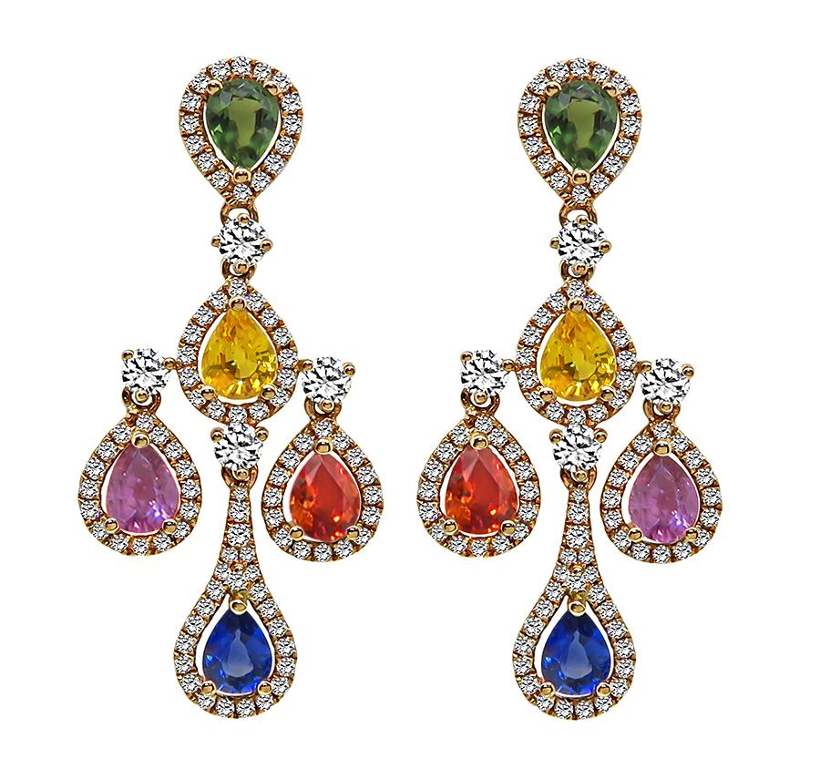 This is fabulous pair of 18k rose gold earrings. The earrings feature lovely multi color pear shape sapphires that weigh approximately 3.67ct. The sapphires are accentuated by sparkling round cut diamonds that weigh approximately 1.42ct. The color