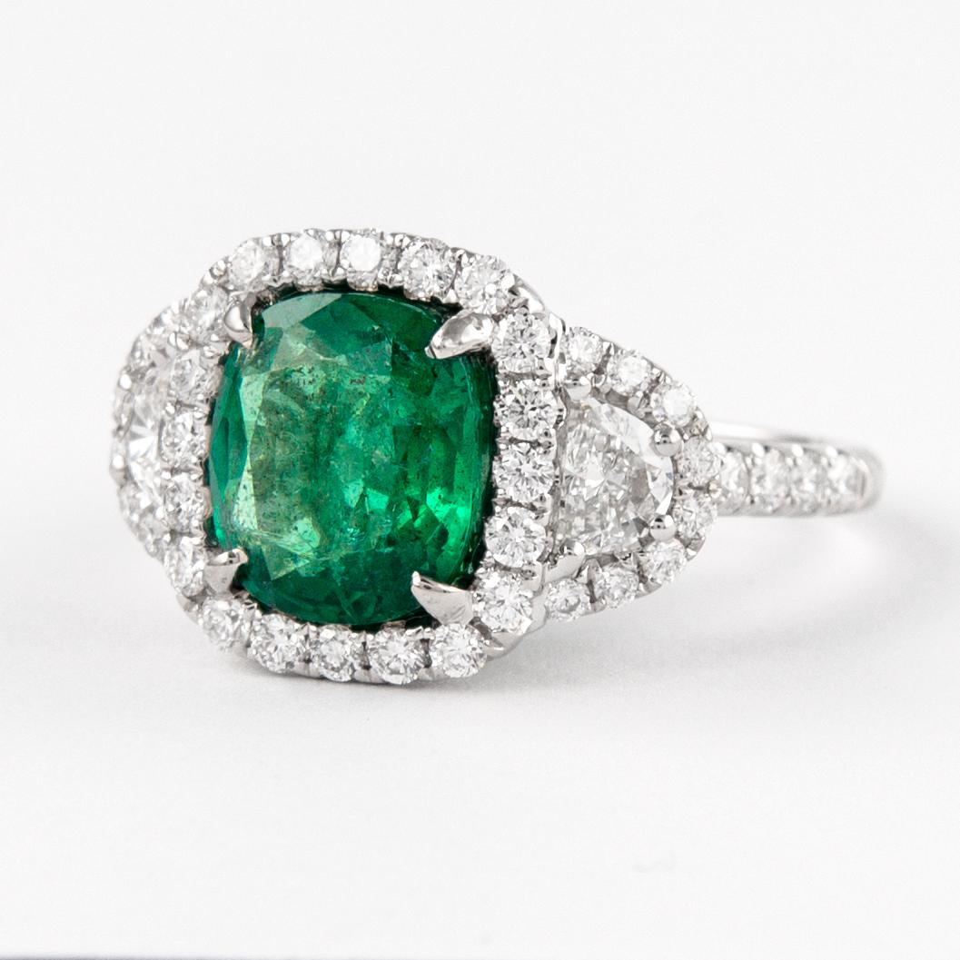 Contemporary 3.67ctt Emerald with Diamond Three Stone Halo Ring 18 Karat Gold For Sale