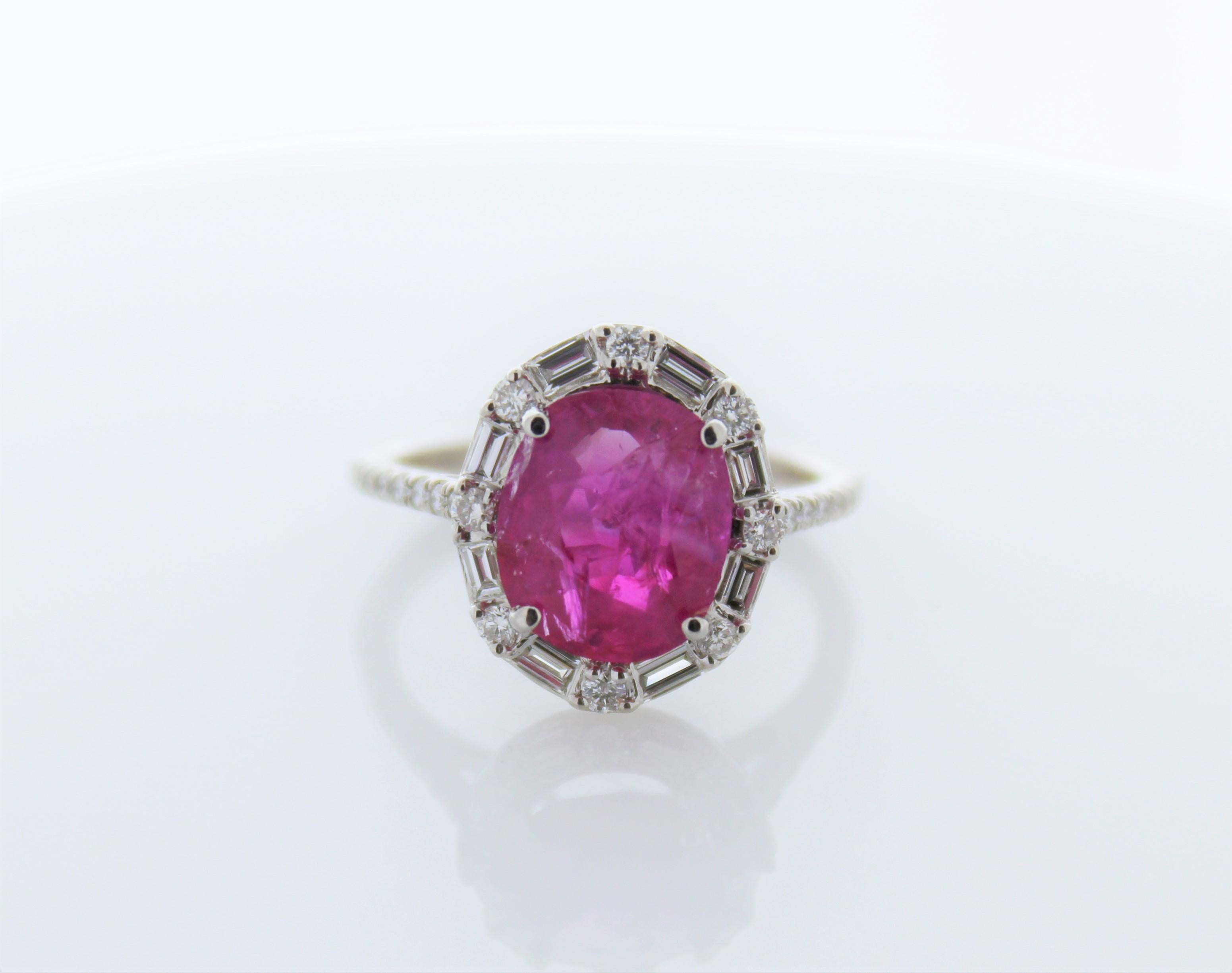 Stylish and sophisticated, this timeless royal ruby and diamond ring is utterly magnificent. No one will be able to take their eyes off the lovely 3.67 carats ruby, which is expertly paired with 32 natural diamonds that total 0.53 carat. The ring is