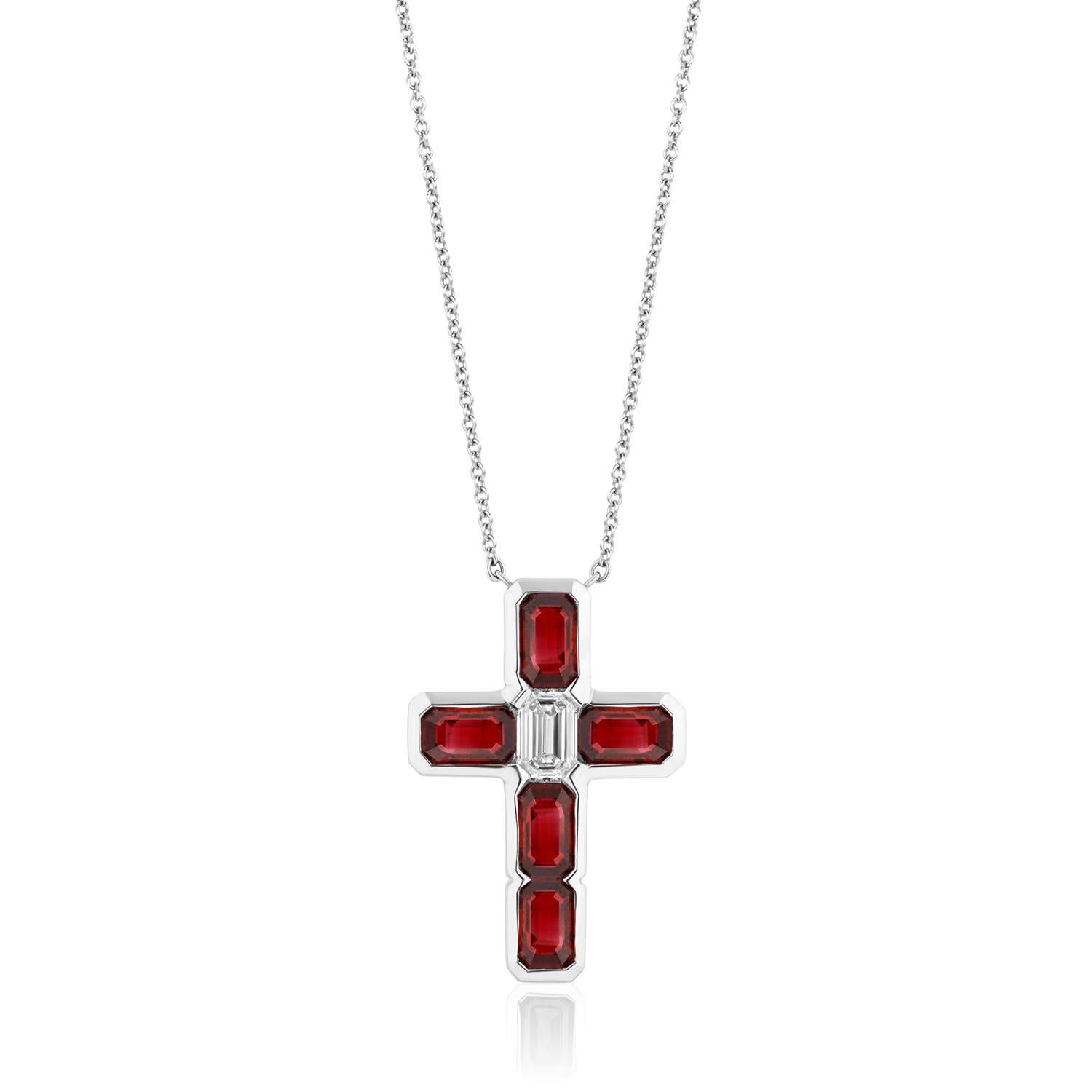 A Fine Ruby and Diamond Cross.
Emerald Cut Rubies and Diamond set in this beautiful and bold Cross.
5 Emerald Cut Rubies weighing 3.13 Carats. 1 Diamond Weighing 0.55 Carats.
Set in Platinum
Chain measures 16 inches. Can be lengthened. 