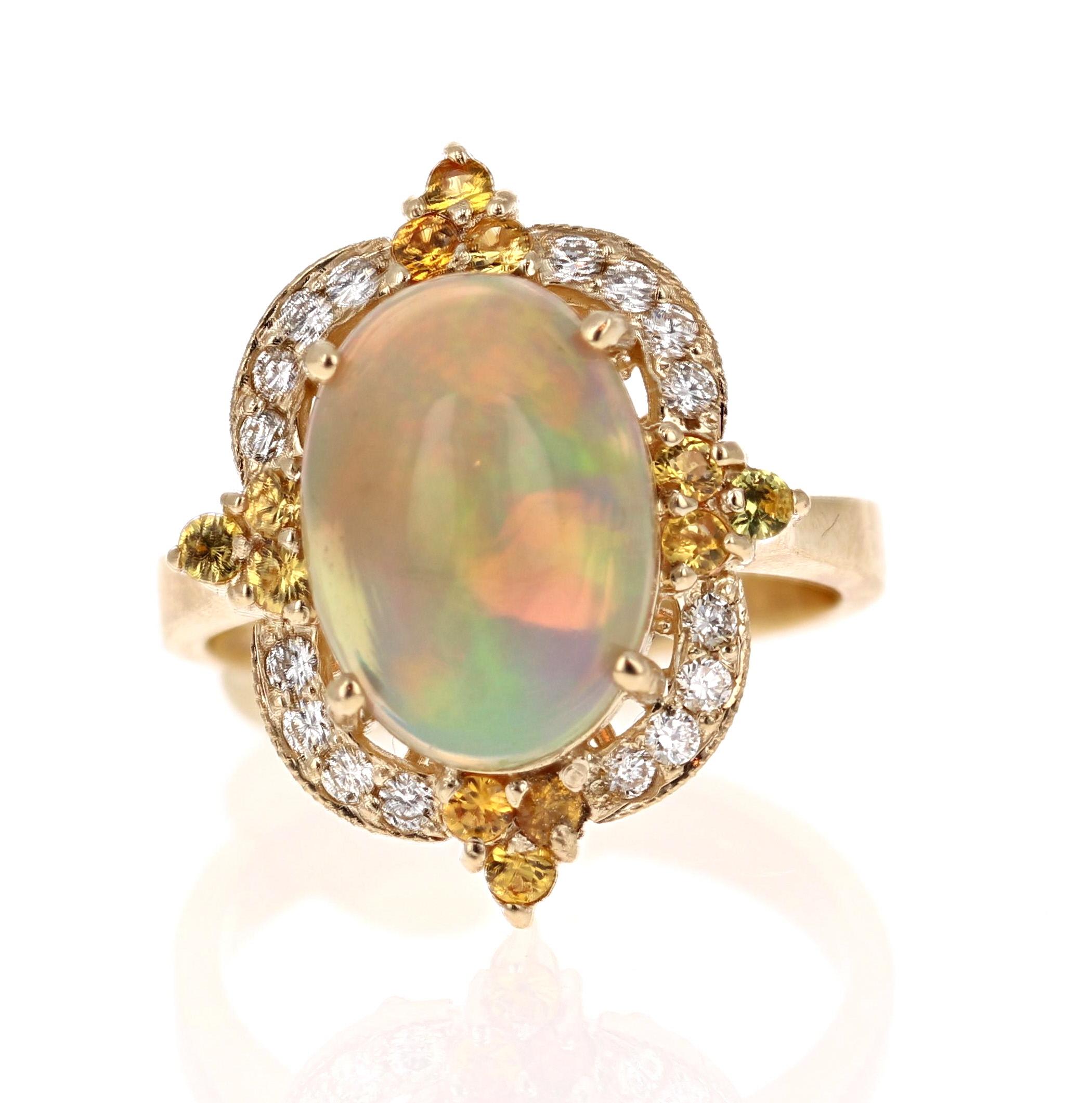 Opulent Opal, Yellow Sapphire and Diamond Ring in 14K Yellow Gold.

The beautiful Oval Cut, Ethiopian-Origin Opal with its striking flashes of color weighs 3.03 Carats. The Opal has flashes of color ranging from green, orange, yellow and red.   It