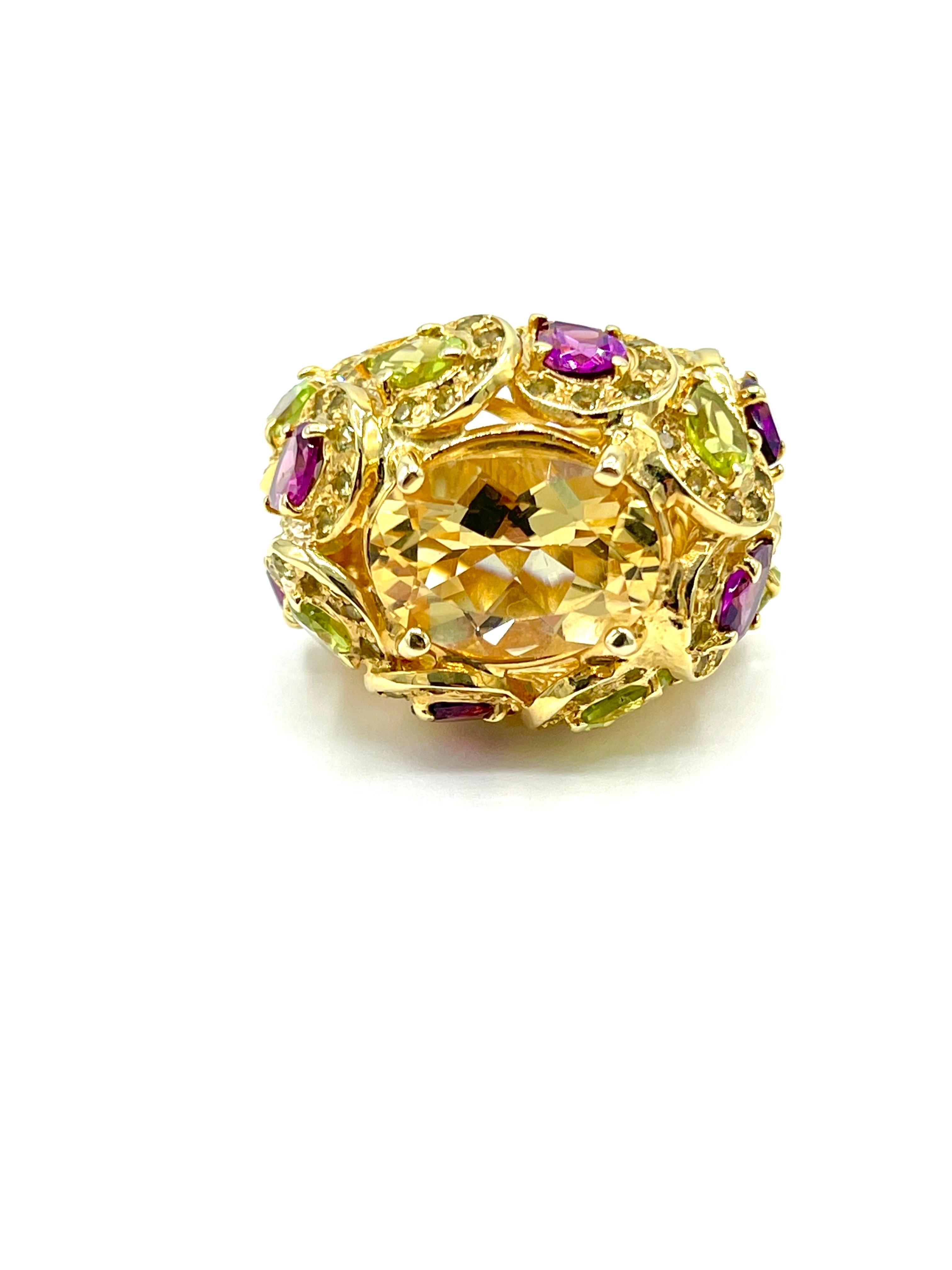 A great fashion ring to wear around town!  The 3.68 carat Citrine is prong set, atop a pear shape gold leaf design set with Diamonds surrounding pear shape Peridot and Garnets in 14k yellow gold.  The ring is currently a size 8.00, and can be