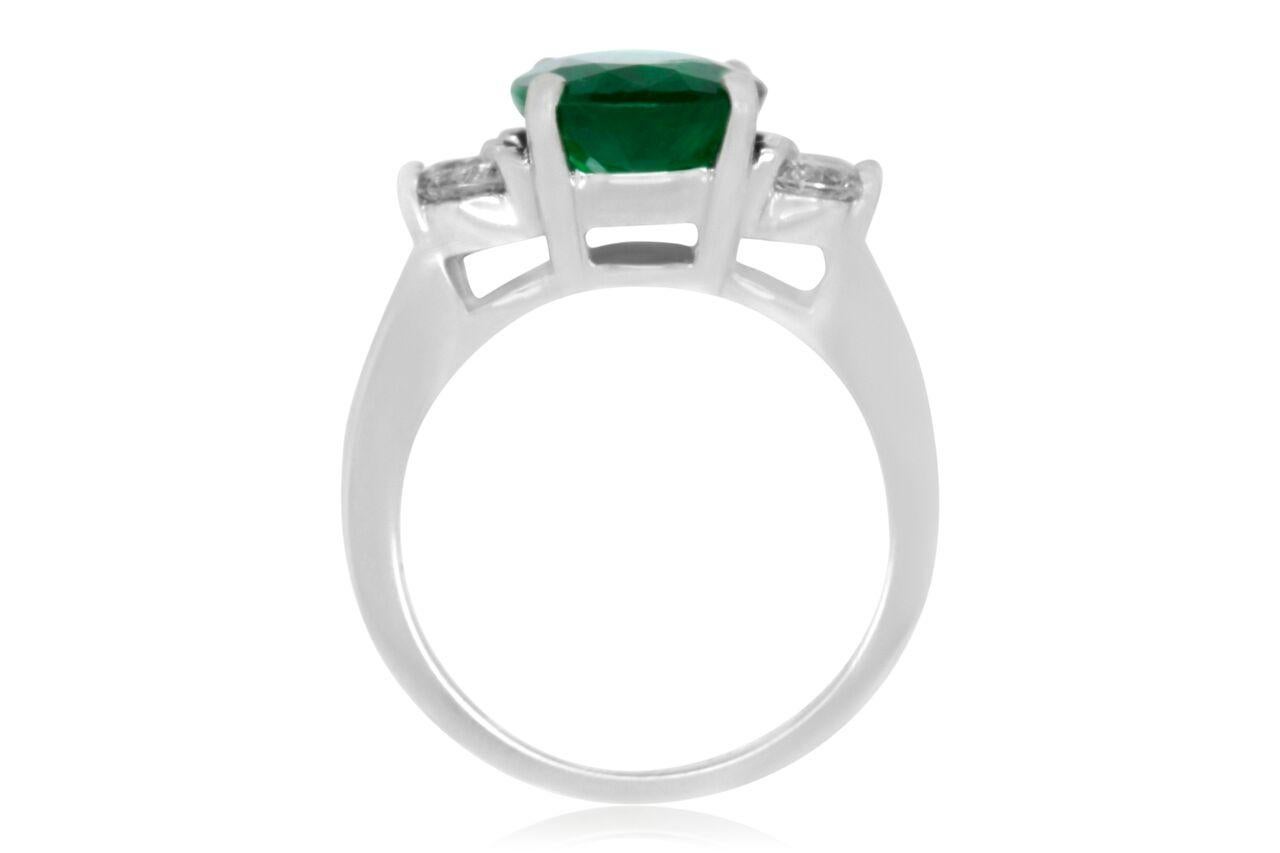 Material: 18k White Gold
Gemstones: 1 Oval Emerald at 3.68 Carats. Measuring 8.7 x 10.9 mm.
Diamonds: 4 Brilliant Round White Diamonds at 0.81 Carats. SI Clarity / H-I Color. 
Ring Size: 6.5. Alberto offers complimentary sizing on all rings.

Fine