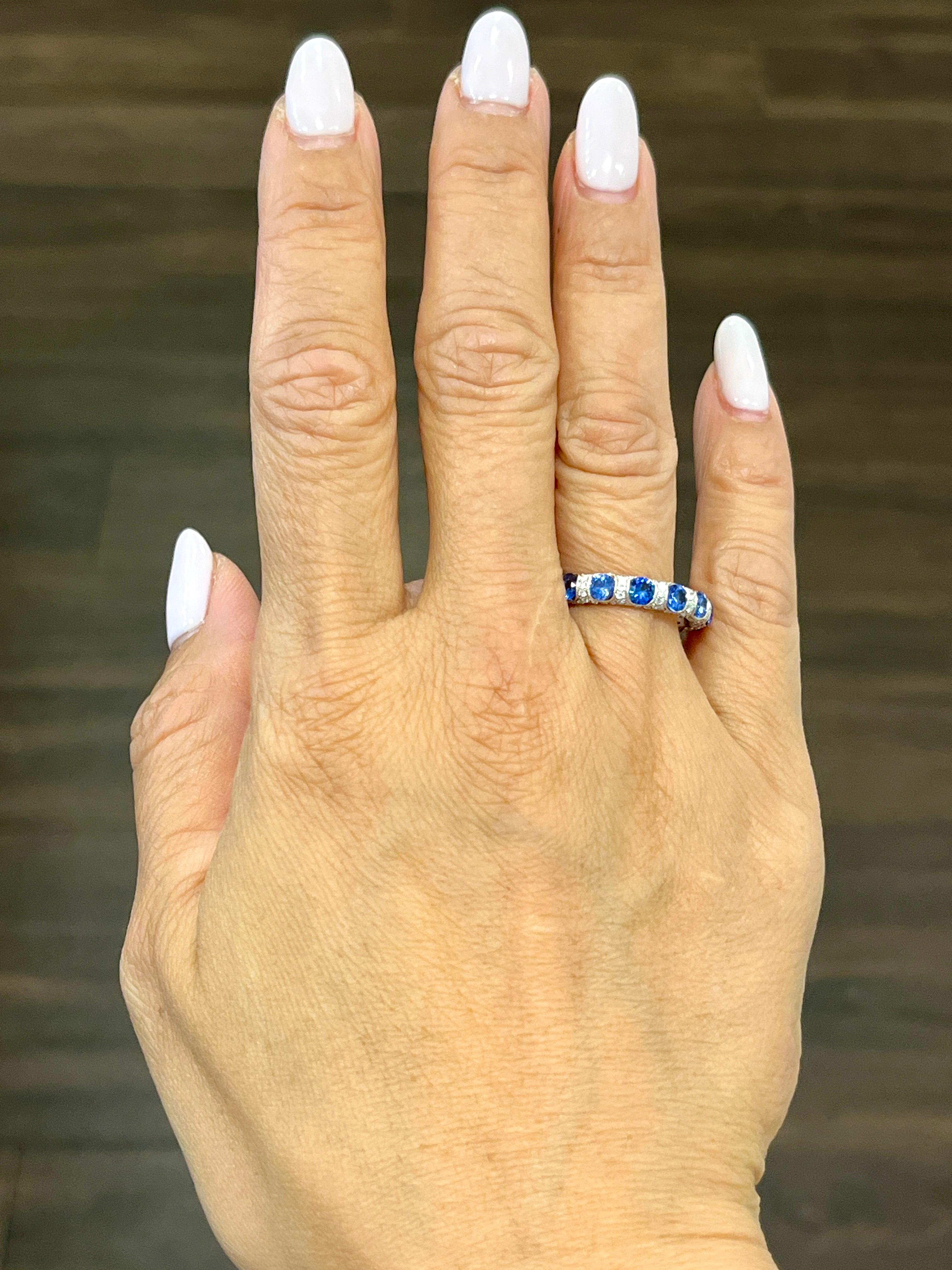 Beautifully handcrafted sapphire and diamond eternity band. The band features 14 sapphires weighing 2.52 ct and 154 diamonds weighing 1.16 ct set in 18k white gold.

The ring is a size 6.5 and can't be resized but can be ordered in your size!