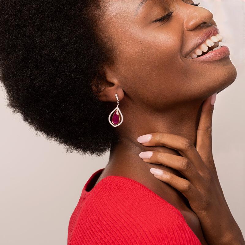 These unique earrings feature 36.84 carat total weight pair of natural watermelon tourmaline slices set in 18 karat white gold and surrounded by a diamond halo with a total weight of 2.05 carats. The tourmaline slices are connected by 0.43 carat
