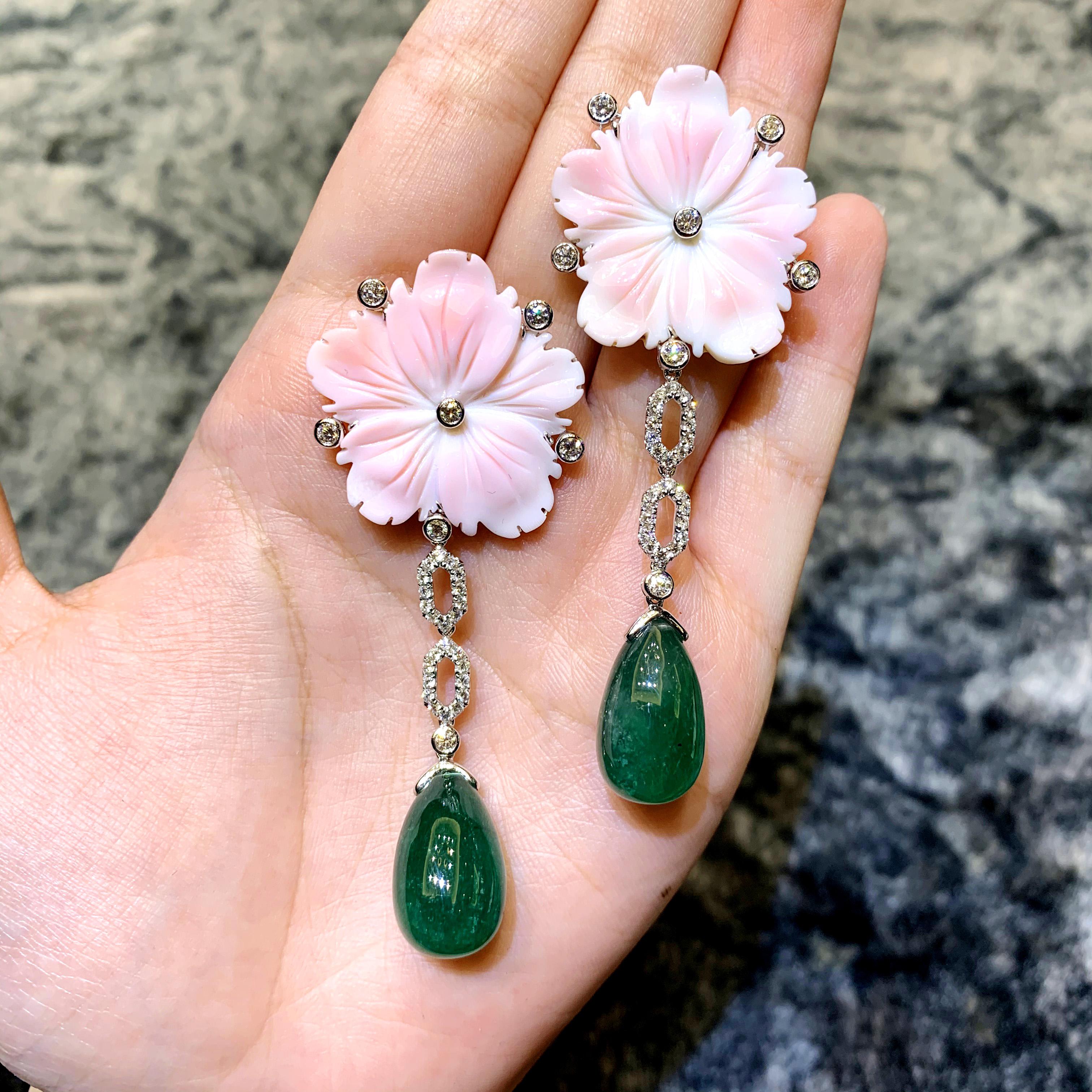 A beautiful pair of 36.85 carat of Zambian Emerald is set with pink carved shell. A great addition to your cocktail jewelry collection. The shell are carved by hand and the emerald is picked out of an old jewelry. 