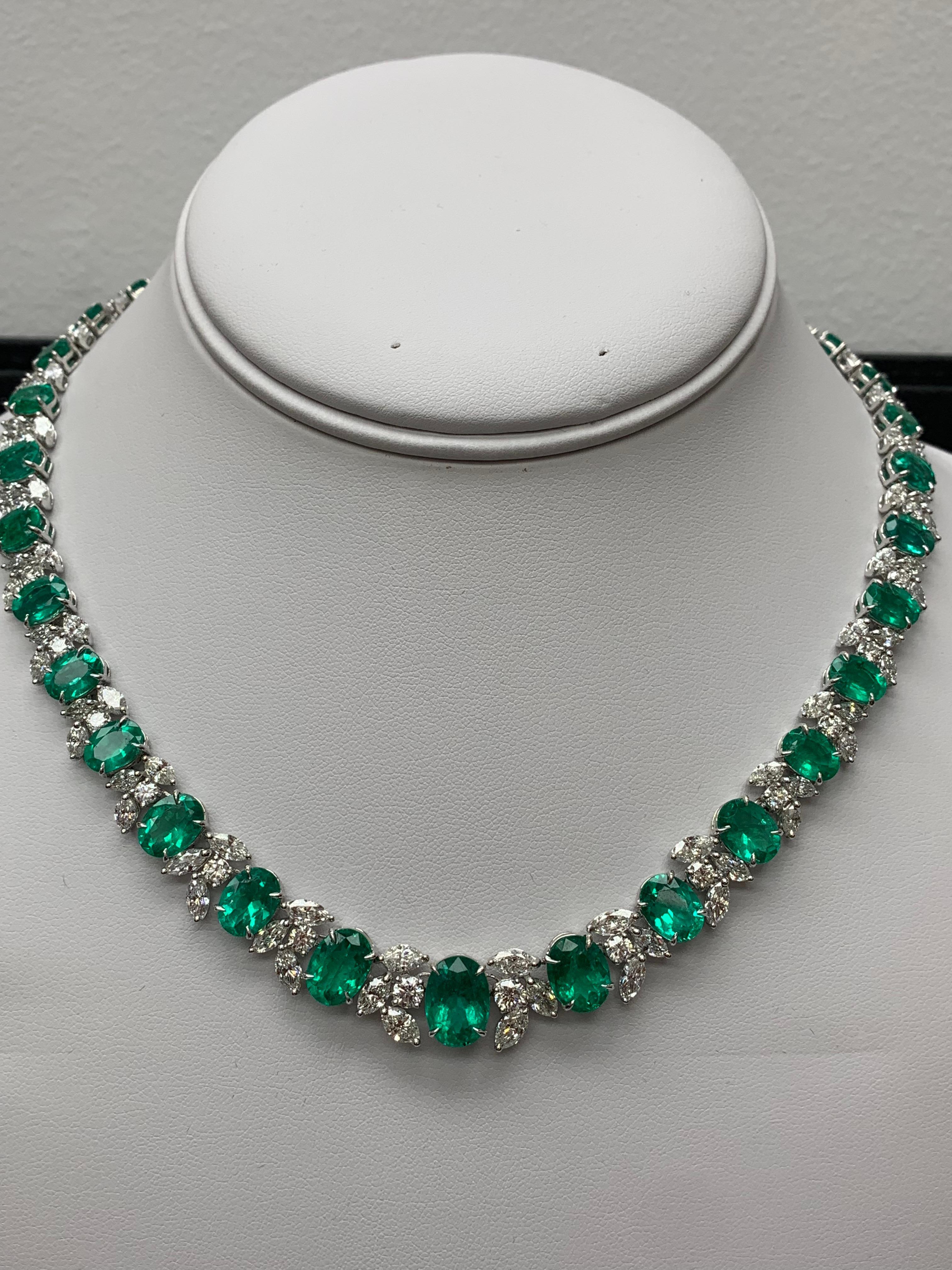 A spectacular piece of jewelry showcasing 36.87 carats of color-rich oval-cut emeralds that elegantly alternate with mixed-cut white diamonds. 108 marquise cut diamonds weigh 15.25 carats and 36 round diamonds weighing 3.79 carats in total. Each