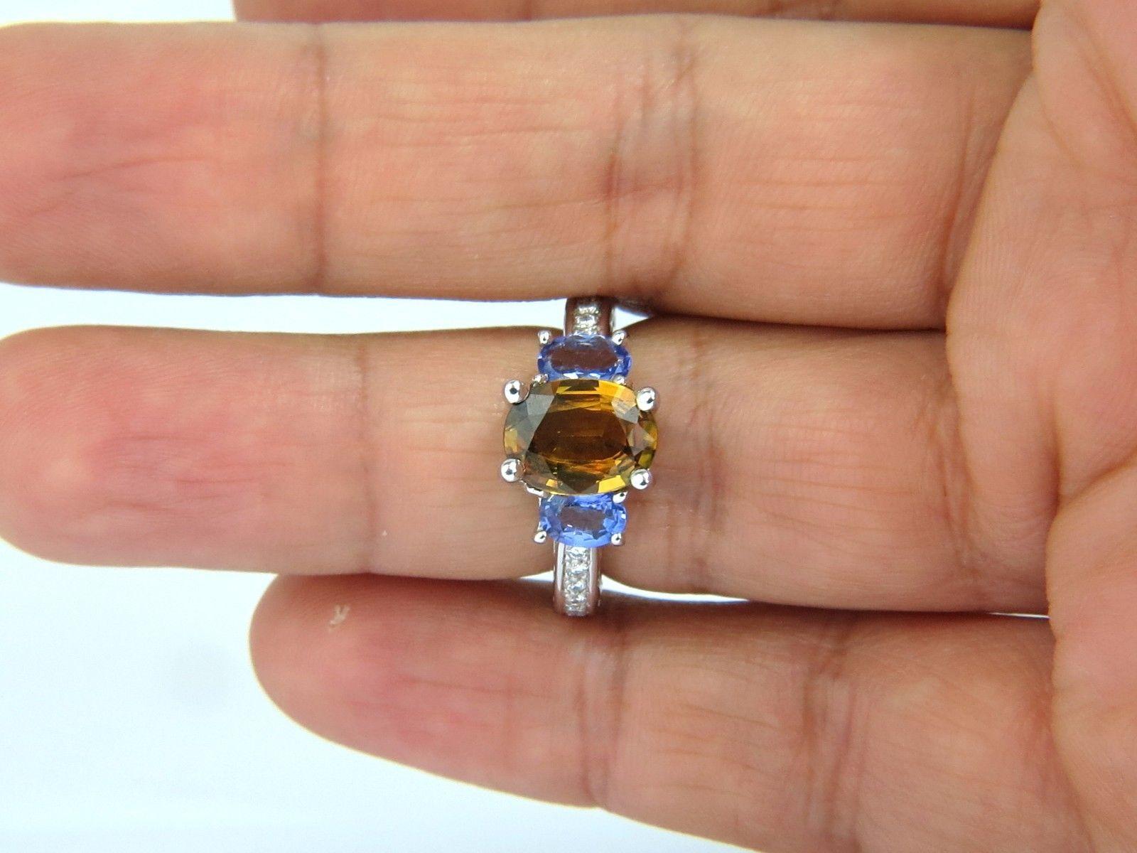 2.28ct Natural Sapphire & Tanzanite ring. 

Sapphire of beautiful Fancy Vivid Yellow Brown. 

VS- Clean Clarity 

10.4 X 7.6mm 

Vibrant Saturation 

Fully Faceted Oval Shape for maximum brilliance 

Clean Clarity and transparent 


.90ct. Natural