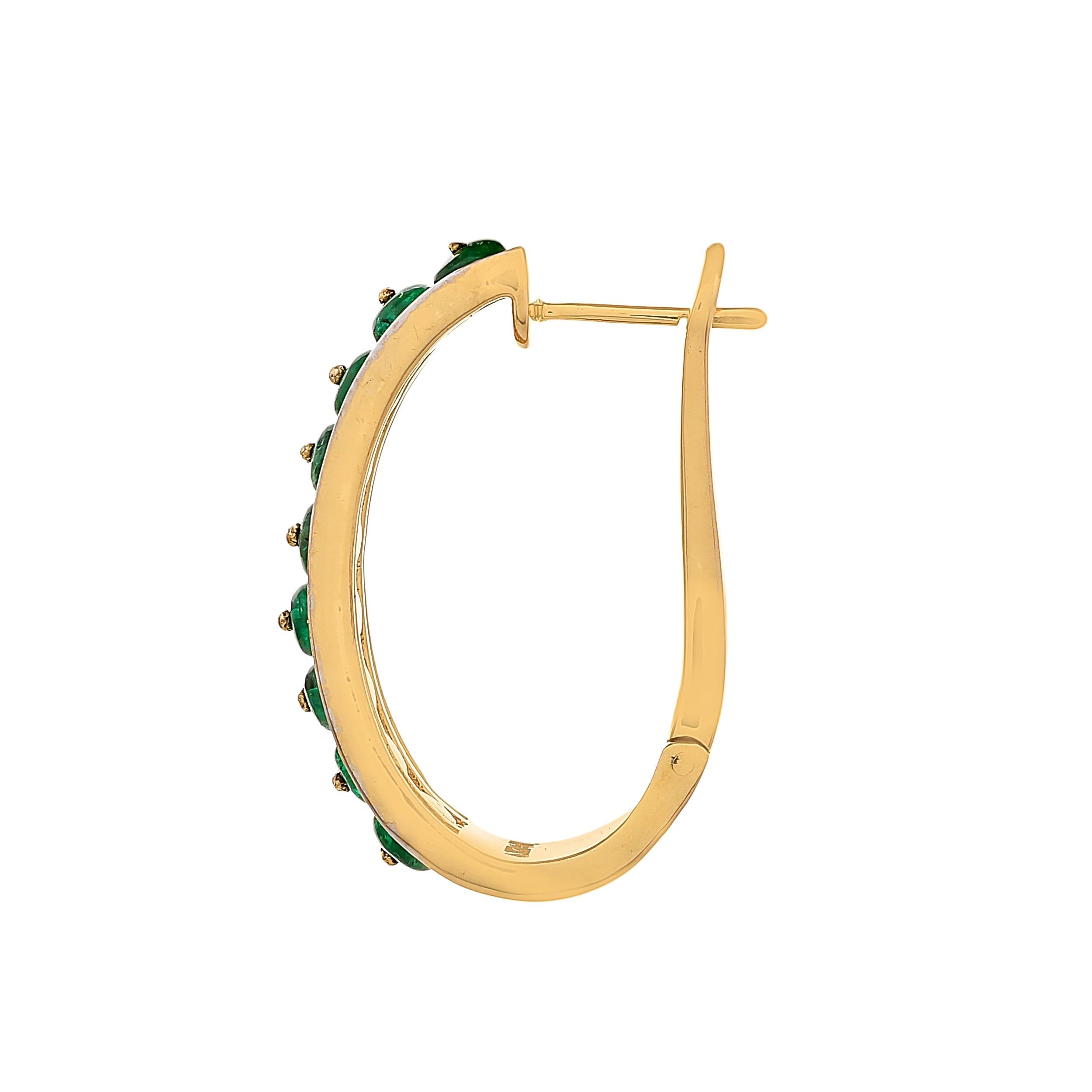 Handcrafted in 18kts yellow gold, these stately linear hoop earrings feature Zambian emerald beads weighing approximately 3.69 carats accented with rows of diamond baguettes with a total diamond weight of 2.39 carats showcasing the craft with