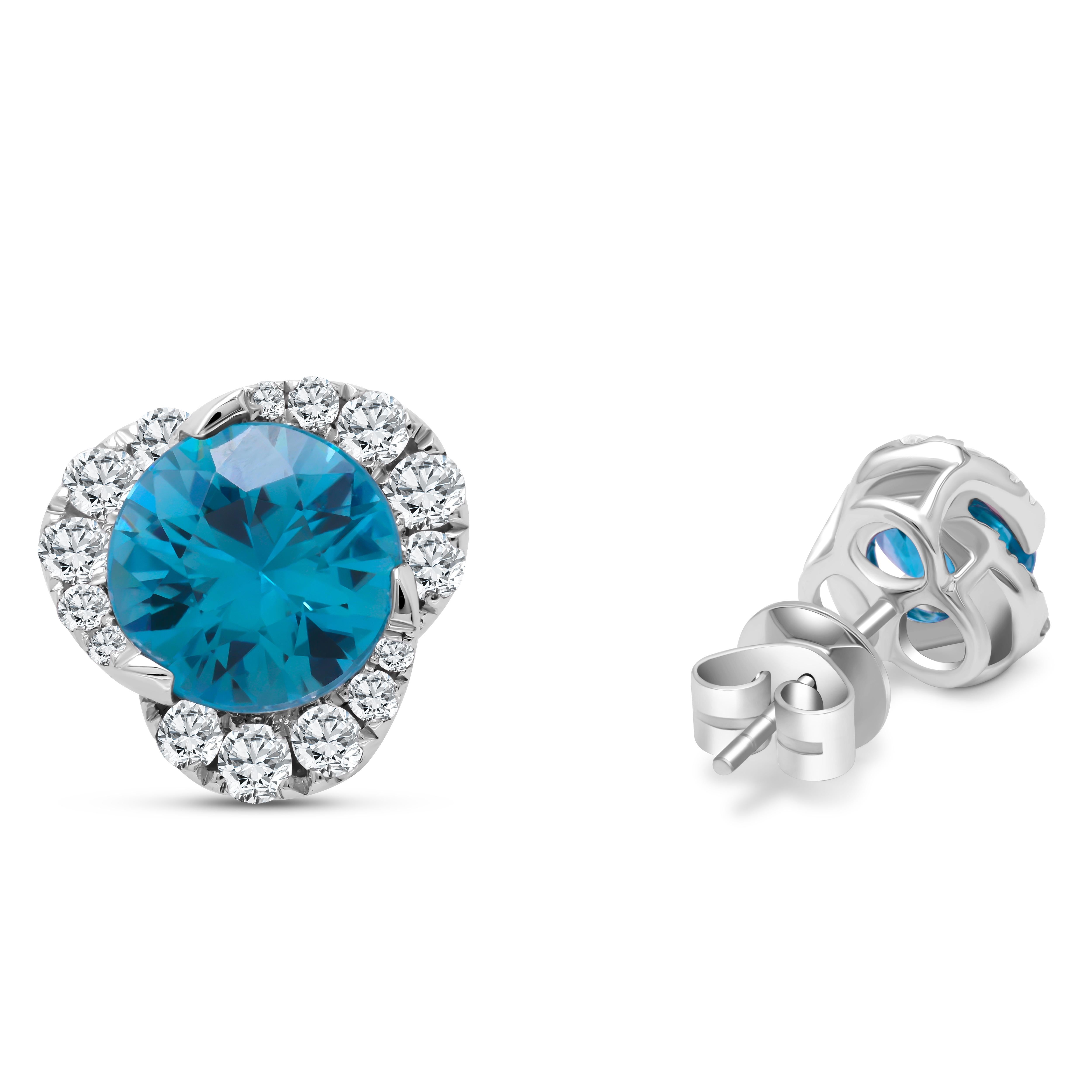 Introducing our exquisite Aqua Blue Zircon and Diamond Swirl Earrings, a true masterpiece of elegance and sophistication. These stunning earrings feature a mesmerizing 3.69 carat aqua blue zircon at their heart, cradled within a graduated swirl of