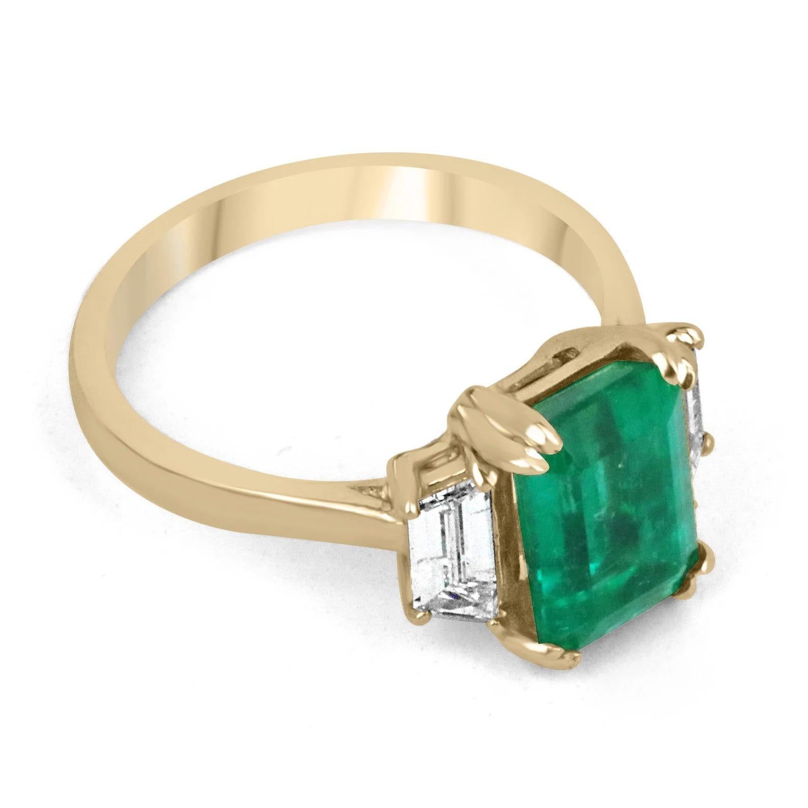 A classic AAA top-grade Colombian emerald and trapezoid diamond engagement, statement, or right-hand ring. Dexterously hand-crafted in gleaming 18K gold this ring features a natural rare Colombian emerald-emerald cut from the famous Muzo mines. Set