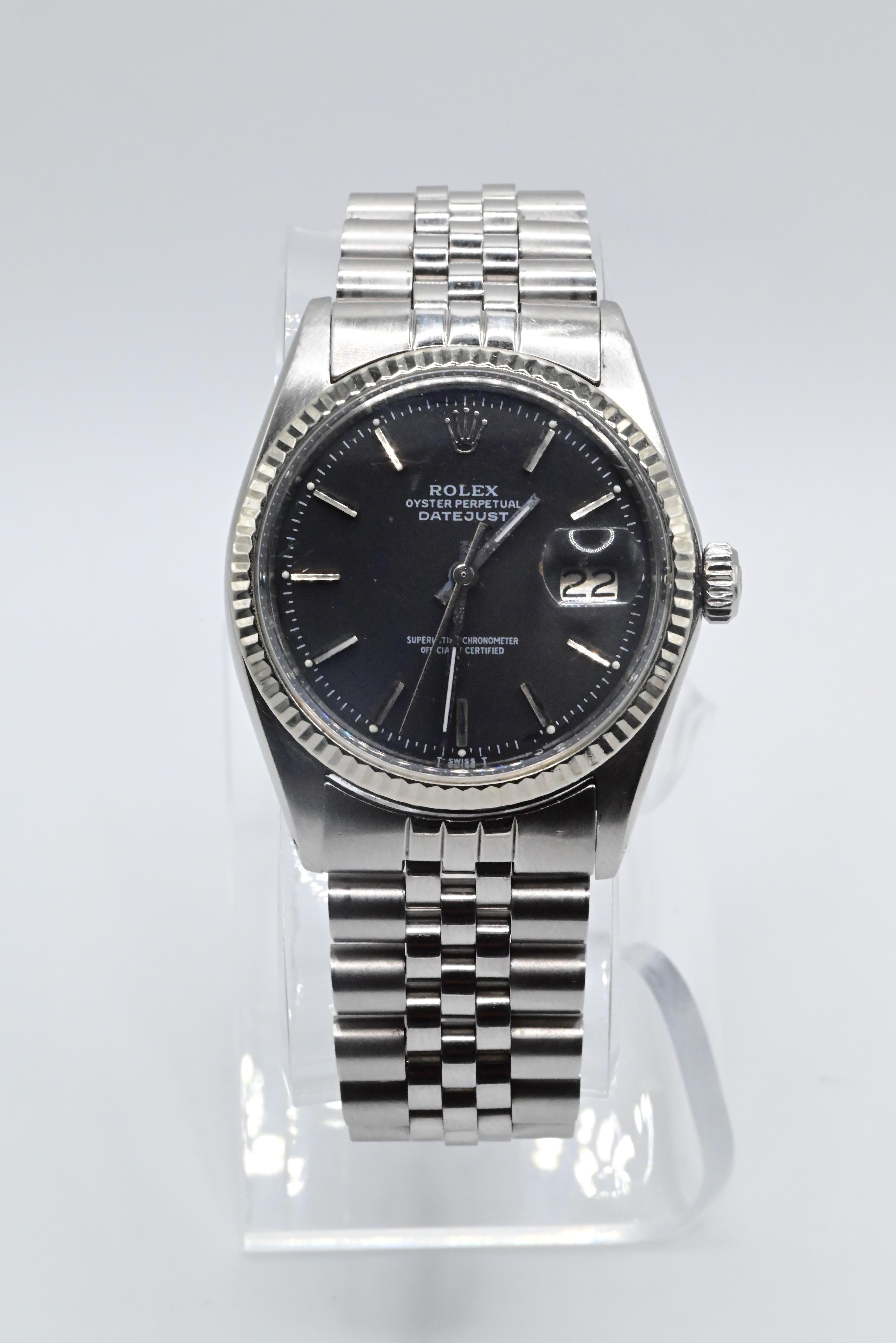 Rolex Wristwatch with Black Dial 1602 Model
Model Datejust 
36MM Size Case
In Perfect Working Order
Has normal use ware but no damage 
Has scratches on Case
Can be worn by Men or Women
No Box or Papers 
1971 Model


