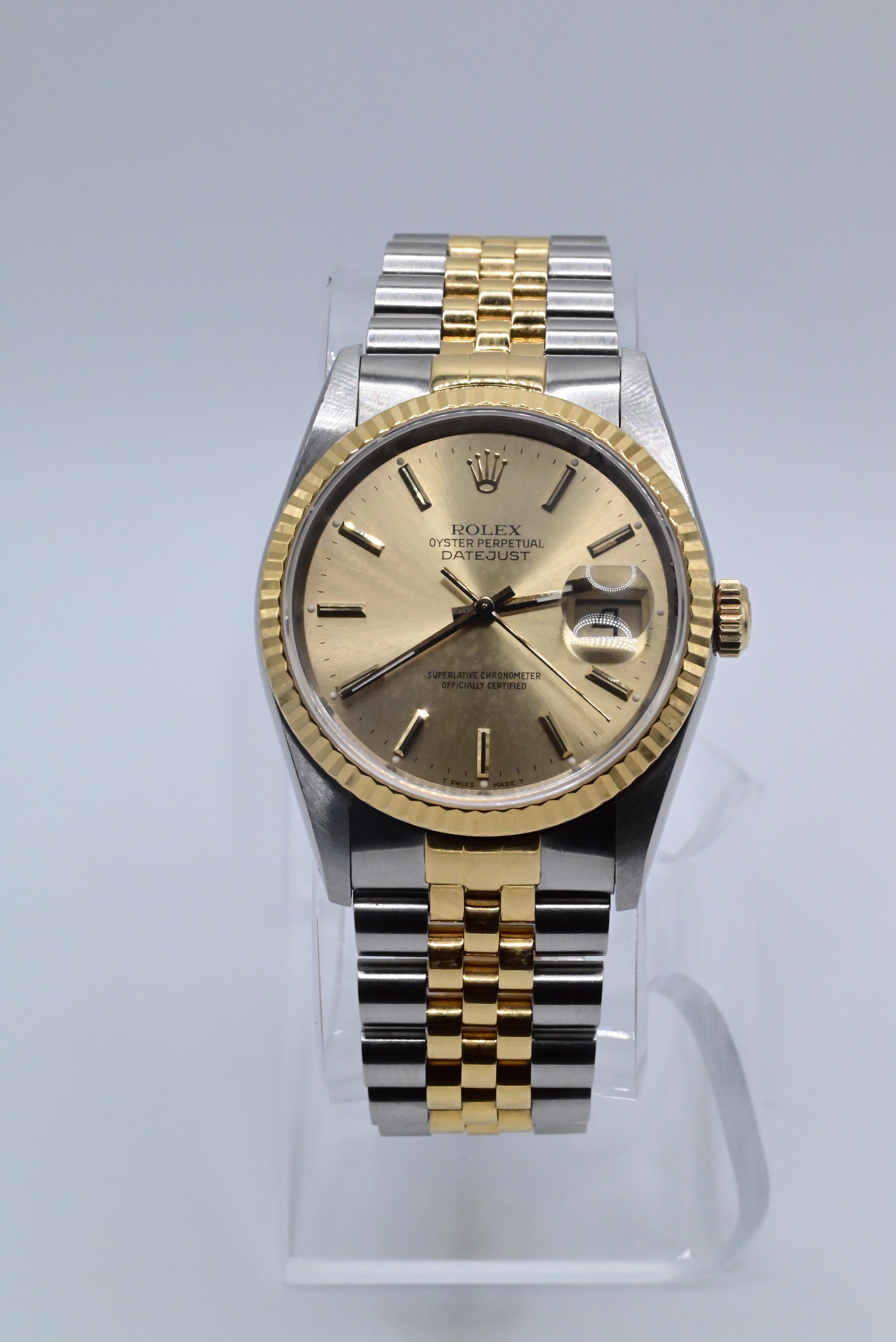 Rolex Wristwatch with Champagne Gold Dial
Model Datejust Two Tone 16013
1989 Model L945475
36MM Size Case
In Perfect Working Order
Has normal use ware but no damage 
Can be worn by Men or Women
No Box or Papers 



