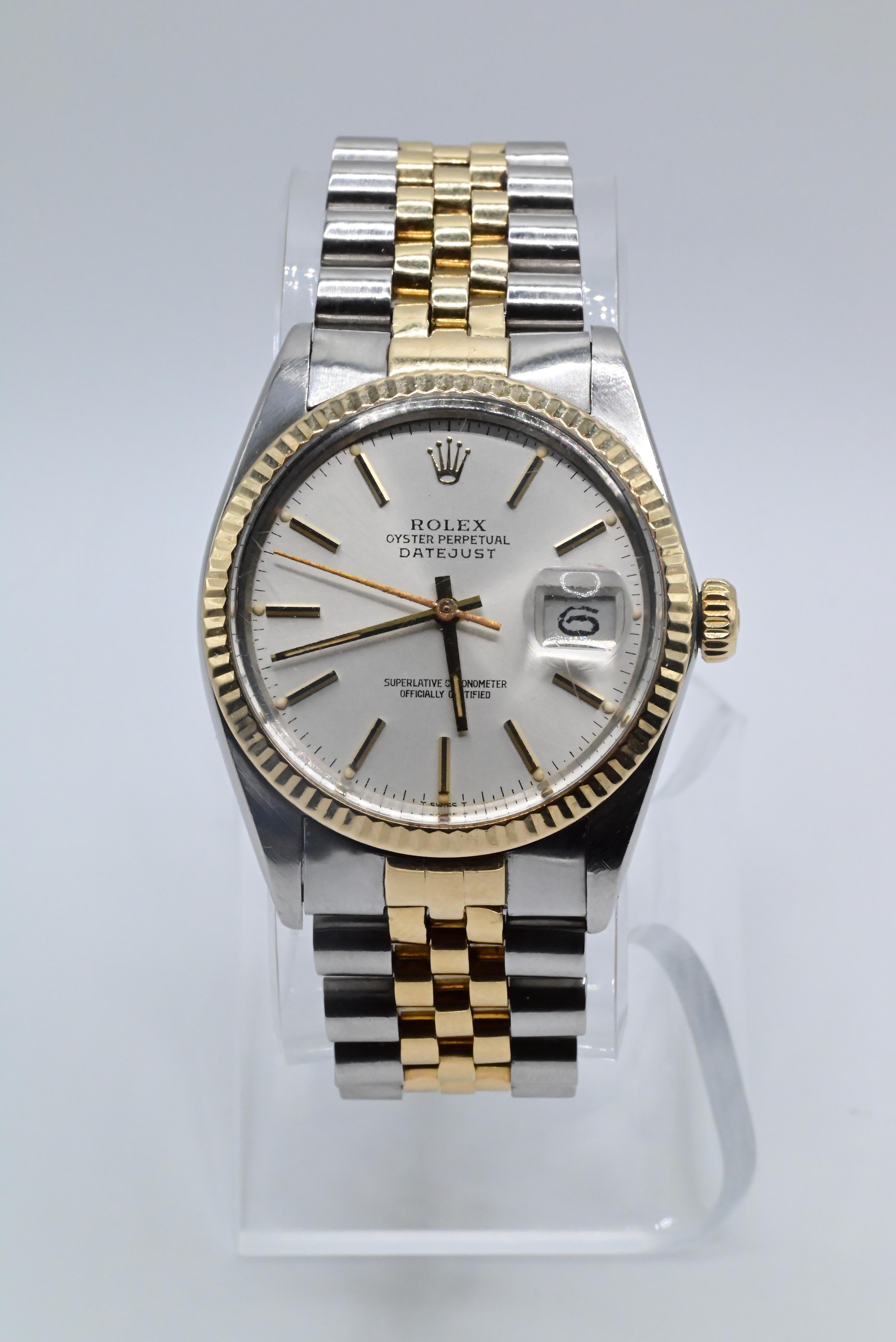 Rolex Wristwatch with Silver Dial 
1981 Model 7295385 Serial Number
Model Datejust Two Tone 16013
36MM Size Case
In Perfect Working Order
Has normal use ware but no mechanical damage 
Has some scratches near they cyclops and sapphire case 
Can be