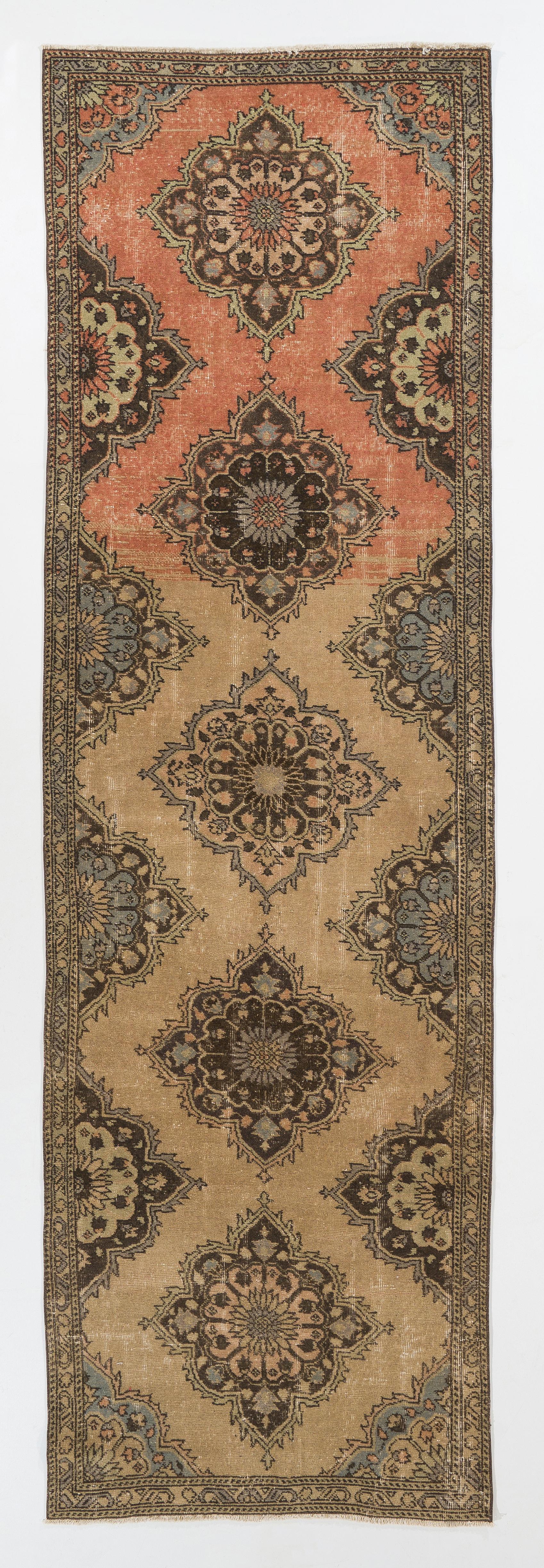 A vintage Turkish runner rug. Finely hand-knotted with even medium wool pile on cotton foundation. Very good condition. Sturdy and as clean as a brand new rug (deep washed professionally).
Measures: 3.6 x 11.7.