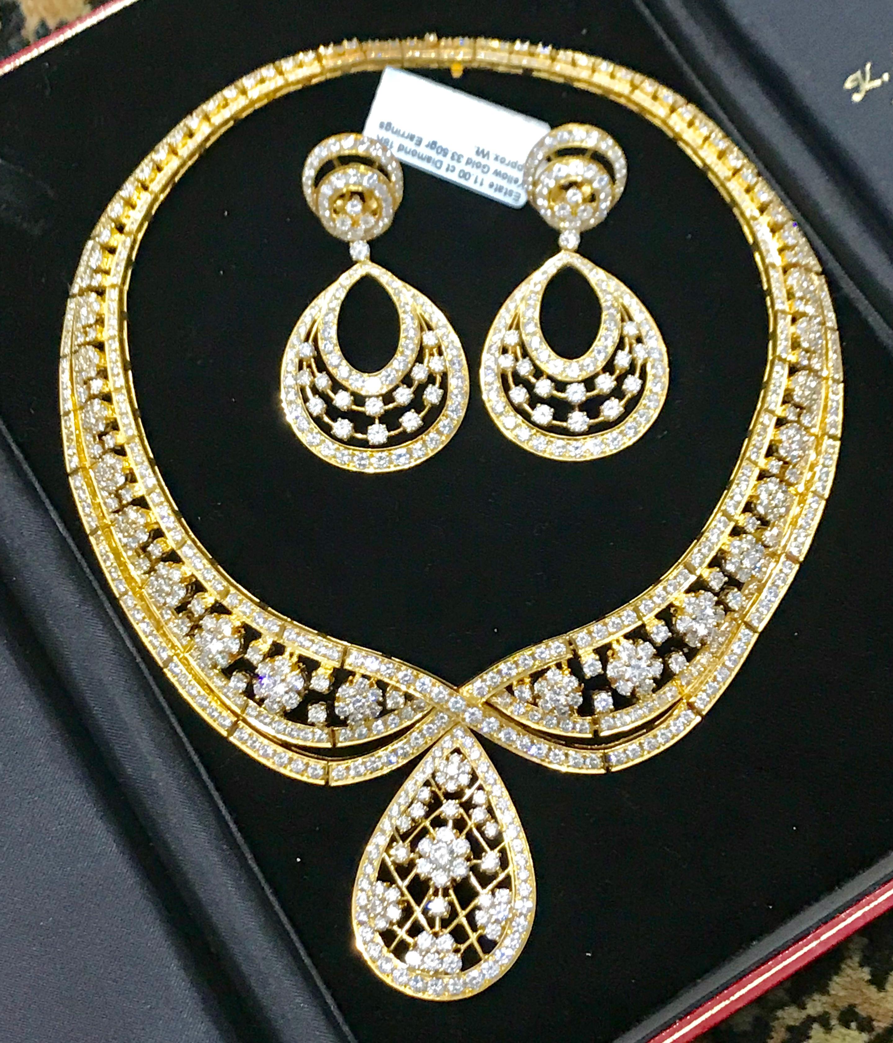 One of our premium neckalce and earring set  from our Bridal collection.
37 carats of VS quality of Diamonds all mounted in 18 karat yellow gold. Weight of the necklace and earrings is 185 grams. The pendulum of necklace can be taken out to make it