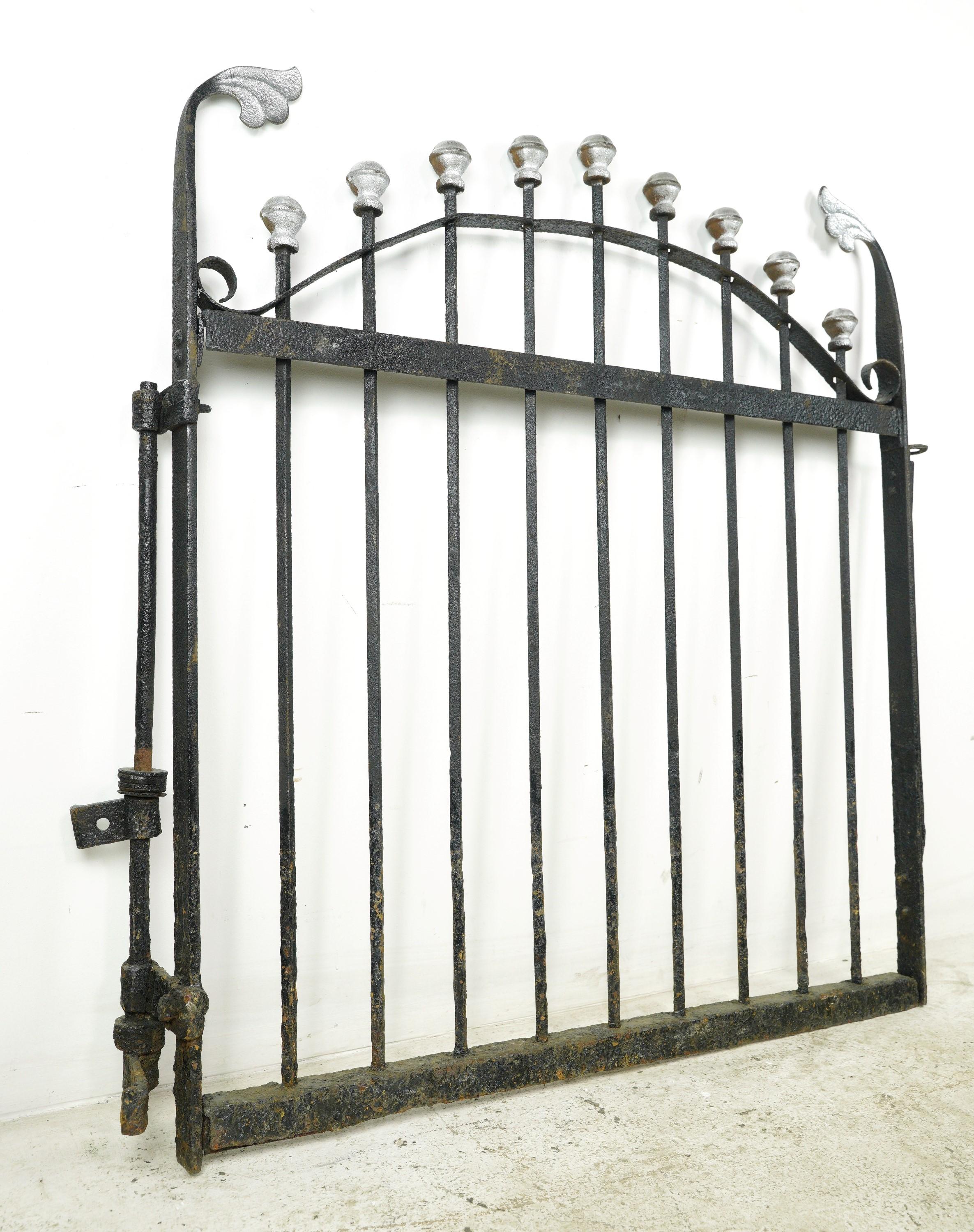 This reclaimed silver painted ball finials wrought iron privacy yard gate is perfect for creating a private outdoor space. Install it securely to add a touch of sophistication. Single installation post is included. It is in good condition, with some