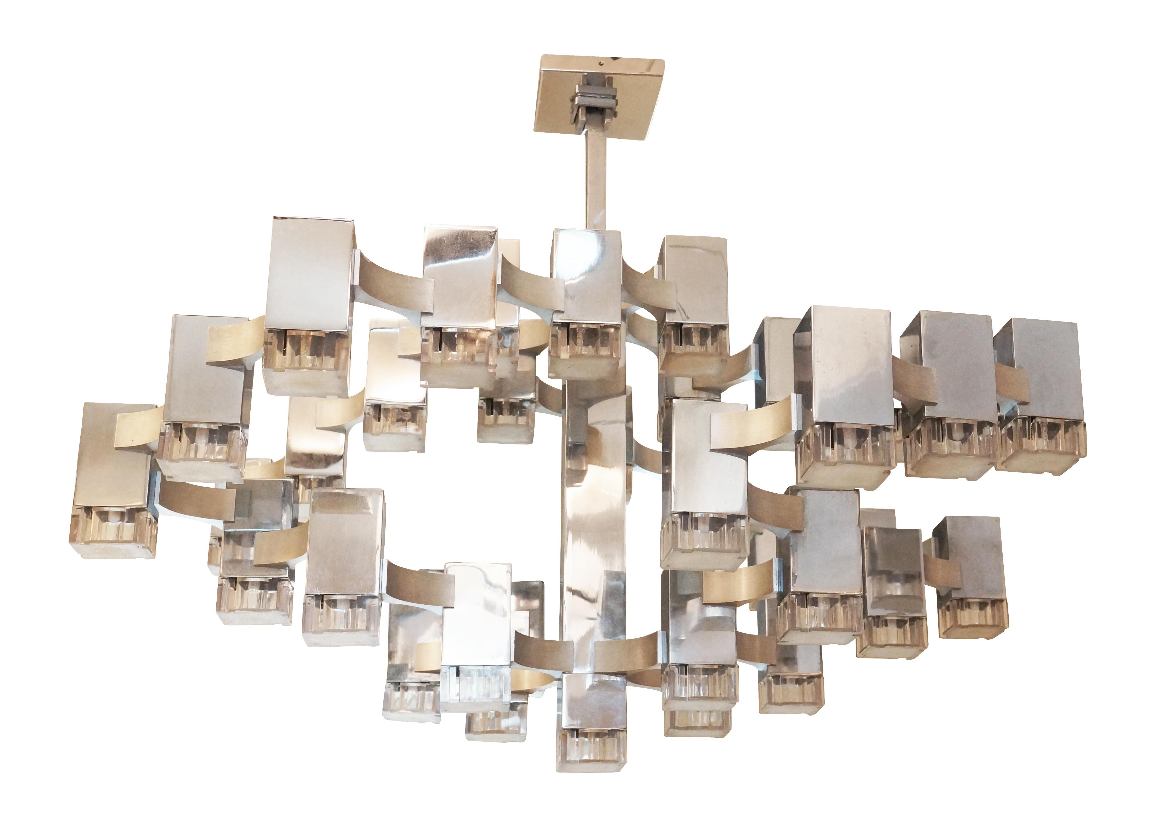 Impressive “cubist” chandelier designed by Sciolari in the 1970s. Features 37 lights on a polished nickel frame with satin nickel accents. Diffusers are acrylic.

Condition: Good vintage condition, minor wear consistent with age and use.

Width: