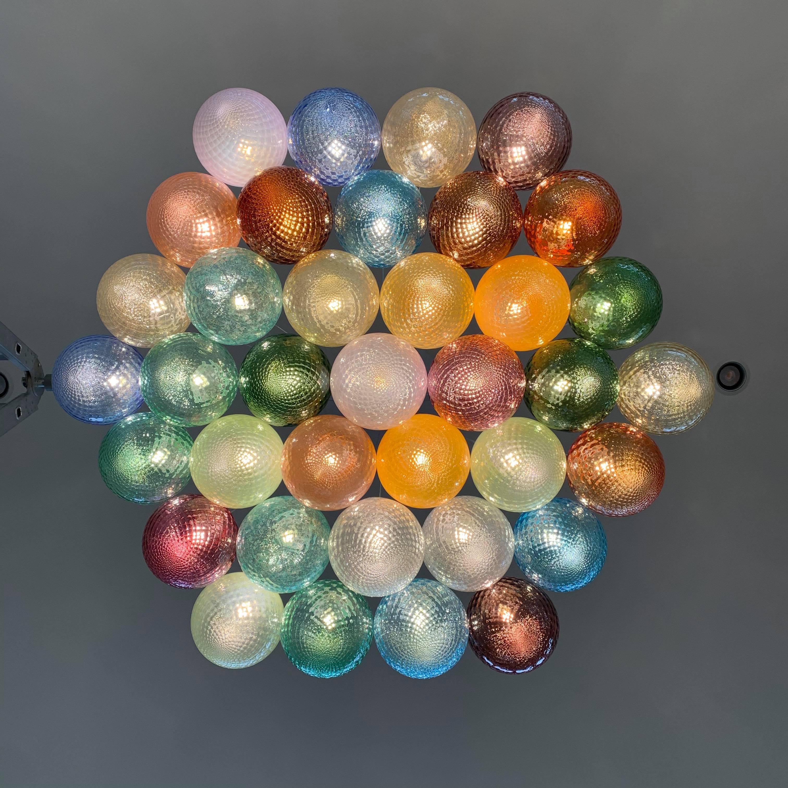 Modern 37 lights ceiling chandelier, with colored transparent Murano glass spheres For Sale