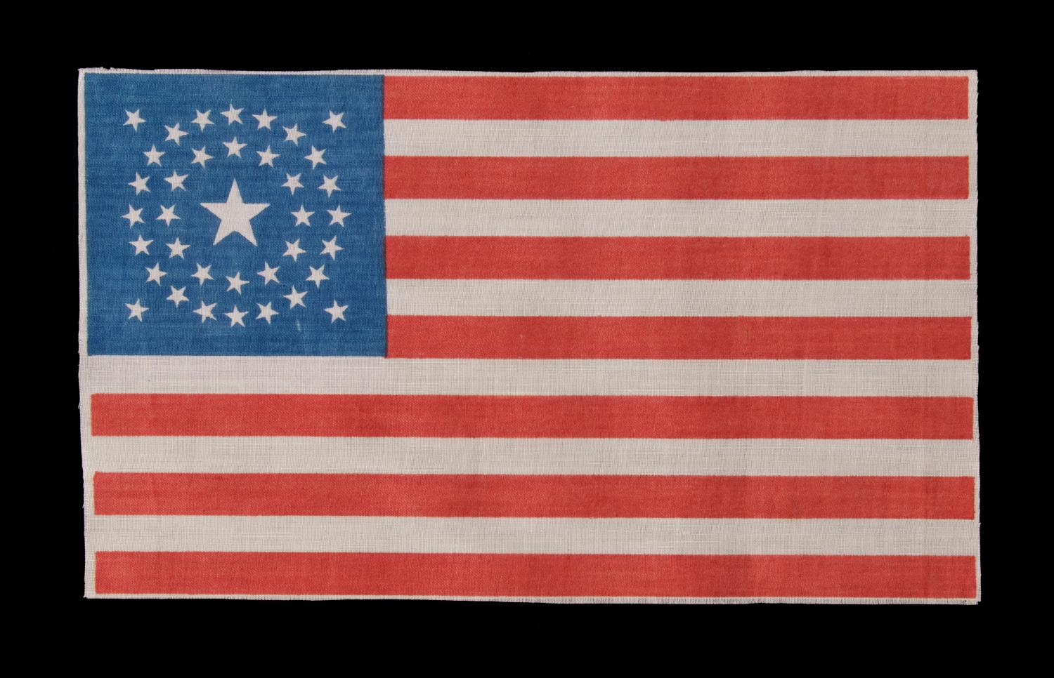 37 STAR ANTIQUE AMERICAN FLAG WITH A DOUBLE-WREATH CONFIGURATION, PROBABLY MADE FOR THE CELEBRATION OF THE CENTENNIAL OF AMERICAN INDEPENDENCE IN 1876, REFLECTS THE TIME DURING WHICH NEBRASKA WAS THE MOST RECENT STATE TO JOIN THE UNION:

37 star