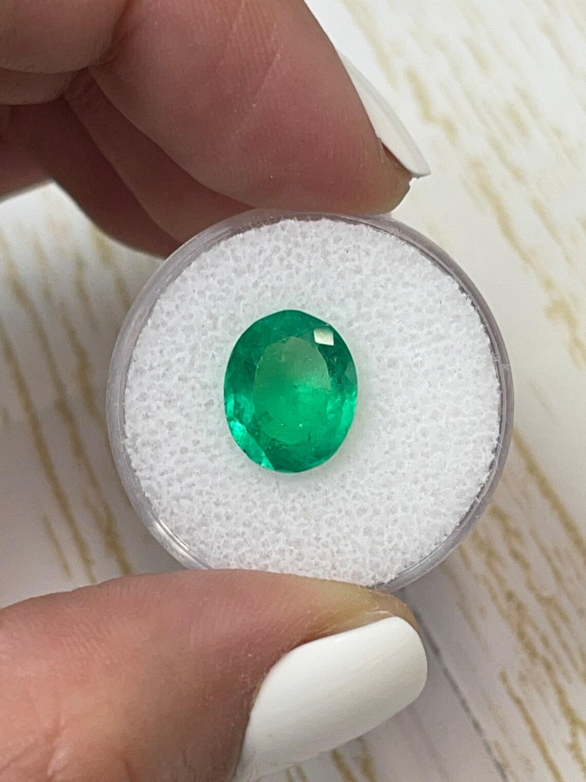 Stone: Emerald
Weight: 3.70-carats
Shape: Oval Cut
Clarity: Transparent
Luster: Very Good
Color: Yellowish Green
Measurements: 11.72mm x 9.58mm x 5.72mm
Geographic Origin: Colombia
Treatment: Natural, Oiling

Comments: Due to their growth conditions