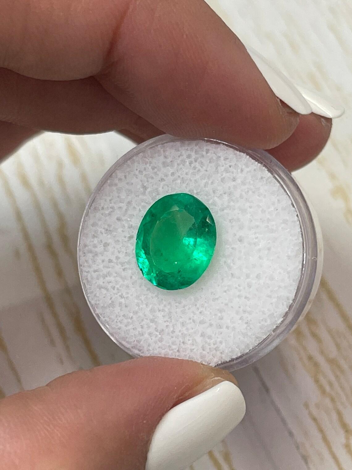 3.70 Carat 12x10 Electric Green Colombian Emerald - Oval Cut  May Birthstone In New Condition For Sale In Jupiter, FL