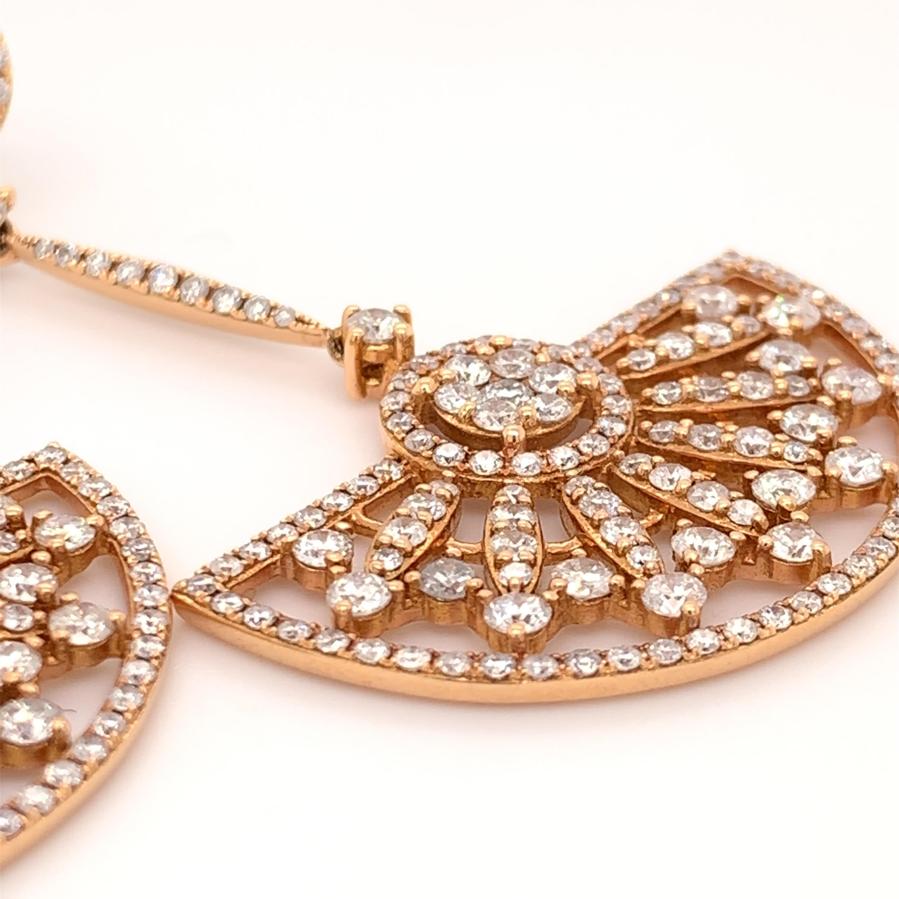 Glamorous diamond dangling earrings. Sparkling, 3.70 carats, round brilliant cut diamond cluster encased in a bead setting. Handcrafted masterpiece design set in 18 karats rose gold with tapered post and circle butterfly backings. 

Statement