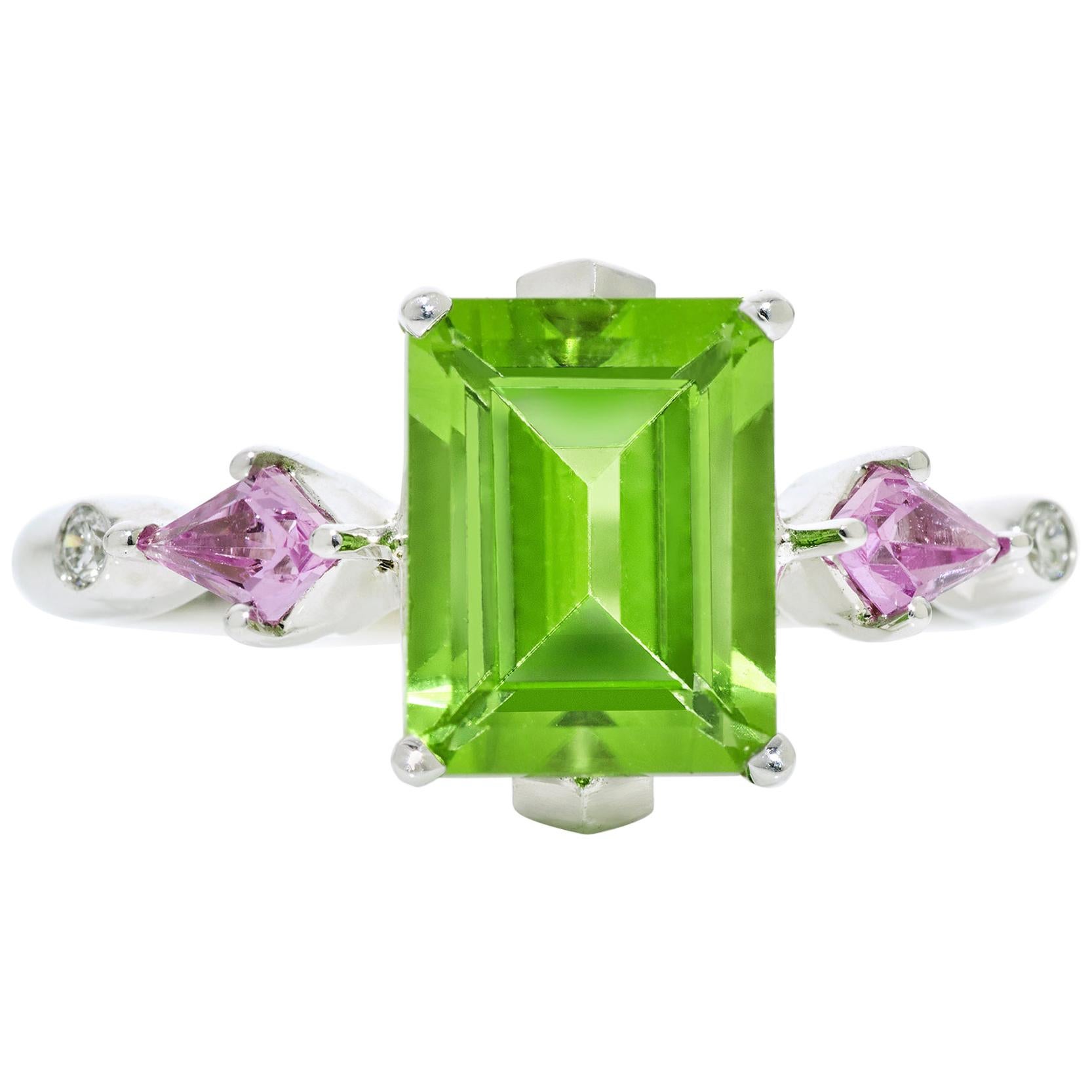 3.70 Carat Emerald Cut Peridot, Kite-Shaped Pink Sapphire and Diamond Ring 18KW For Sale