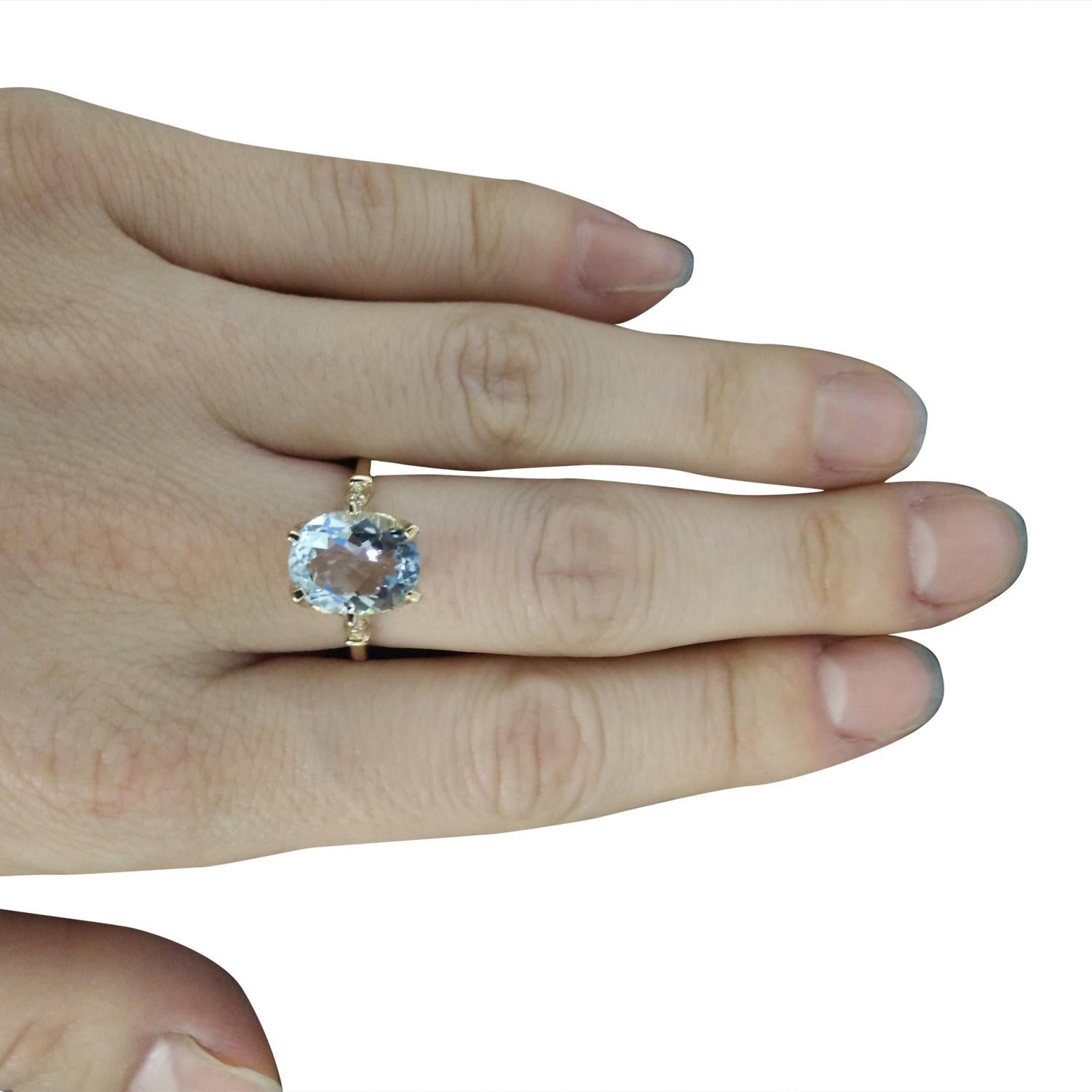 3.70 Carat Natural Aquamarine 14 Karat Solid Yellow Gold Diamond Ring
Stamped: 14K 
Ring Size: 7 
Total Ring Weight: 4.3 Grams 
Aquamarine Weight: 3.55 Carat (11.00x9.00 Millimeter) 
Diamond Weight: 0.15 Carat (F-G Color, VS2-SI1 Clarity) 
Quantity: