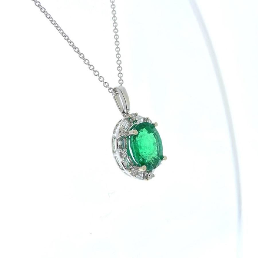 This pendant exudes timeless elegance and allure. Crafted in 14 karat white gold, it showcases a captivating 3.70 carat oval-shaped green emerald as its centerpiece. The emerald's vibrant green hue is truly mesmerizing, evoking a sense of natural